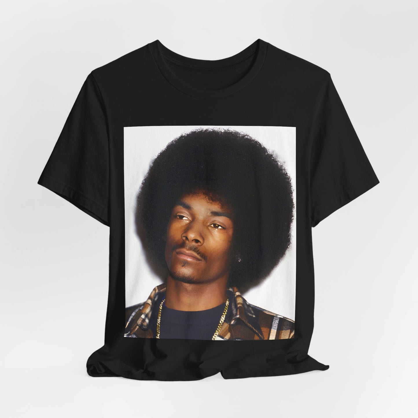 A black graphic t-shirt featuring a 90s vintage hip hop icon graphic of Snoop Dogg.