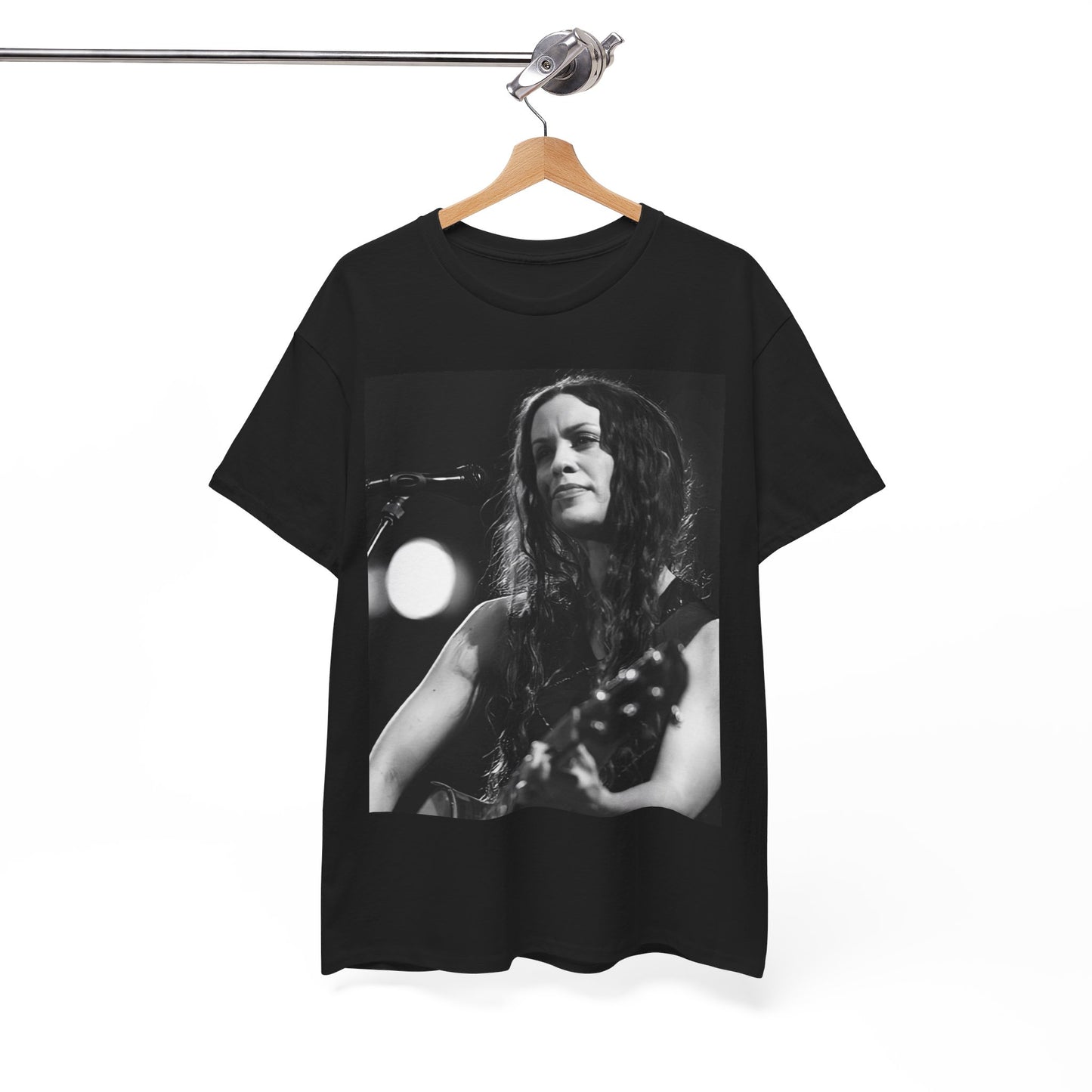 A black graphic t-shirt featuring a 90s-style graphic of Alanis Morissette playing a guitar, with a dynamic expression.