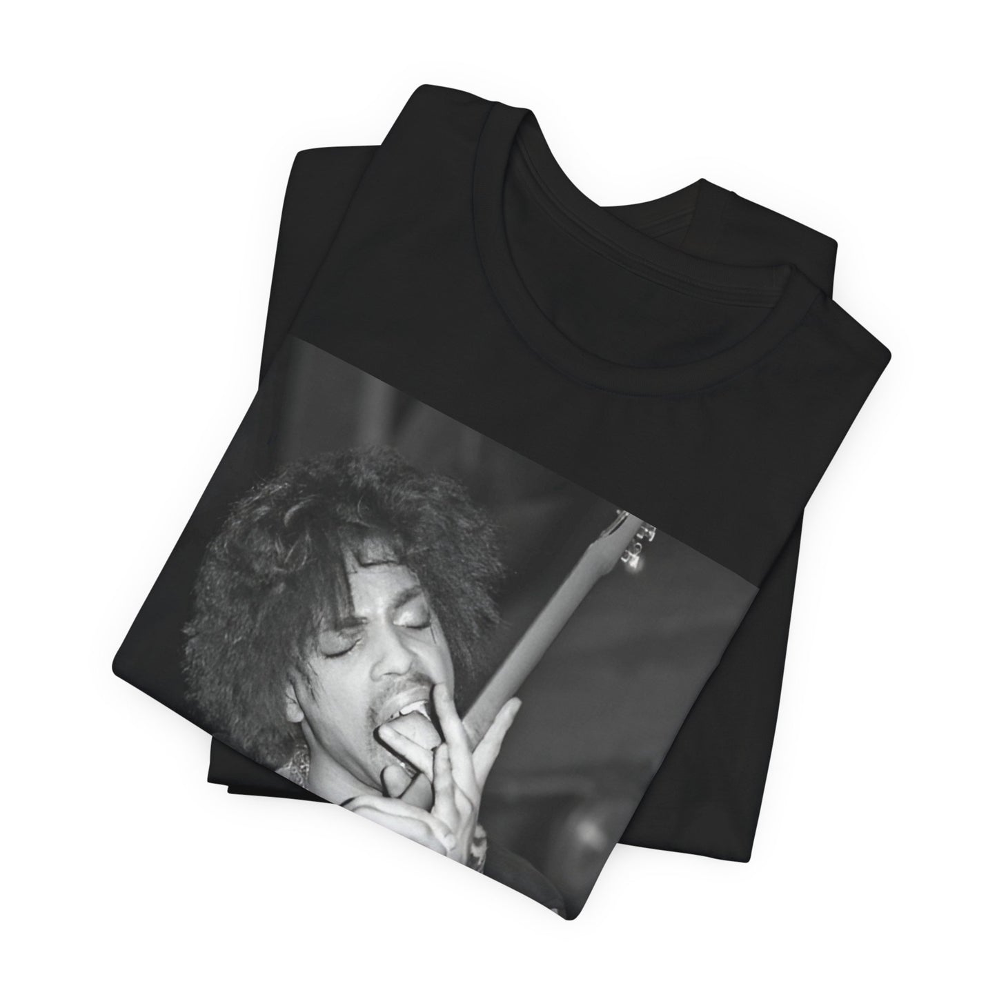 A black graphic t-shirt featuring a graphic or photo of Prince performing wildly on stage.