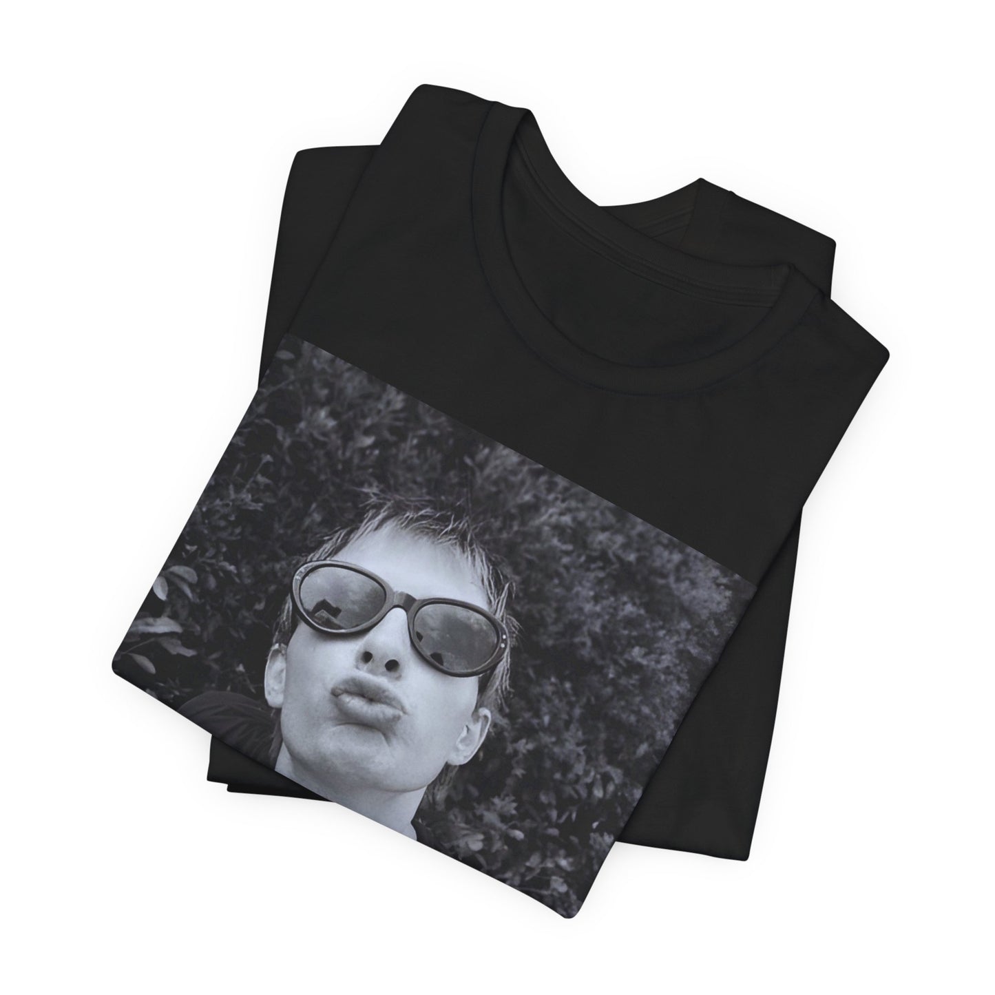 A black graphic t-shirt featuring a retro 90s graphic of Thom Yorke from Radiohead.