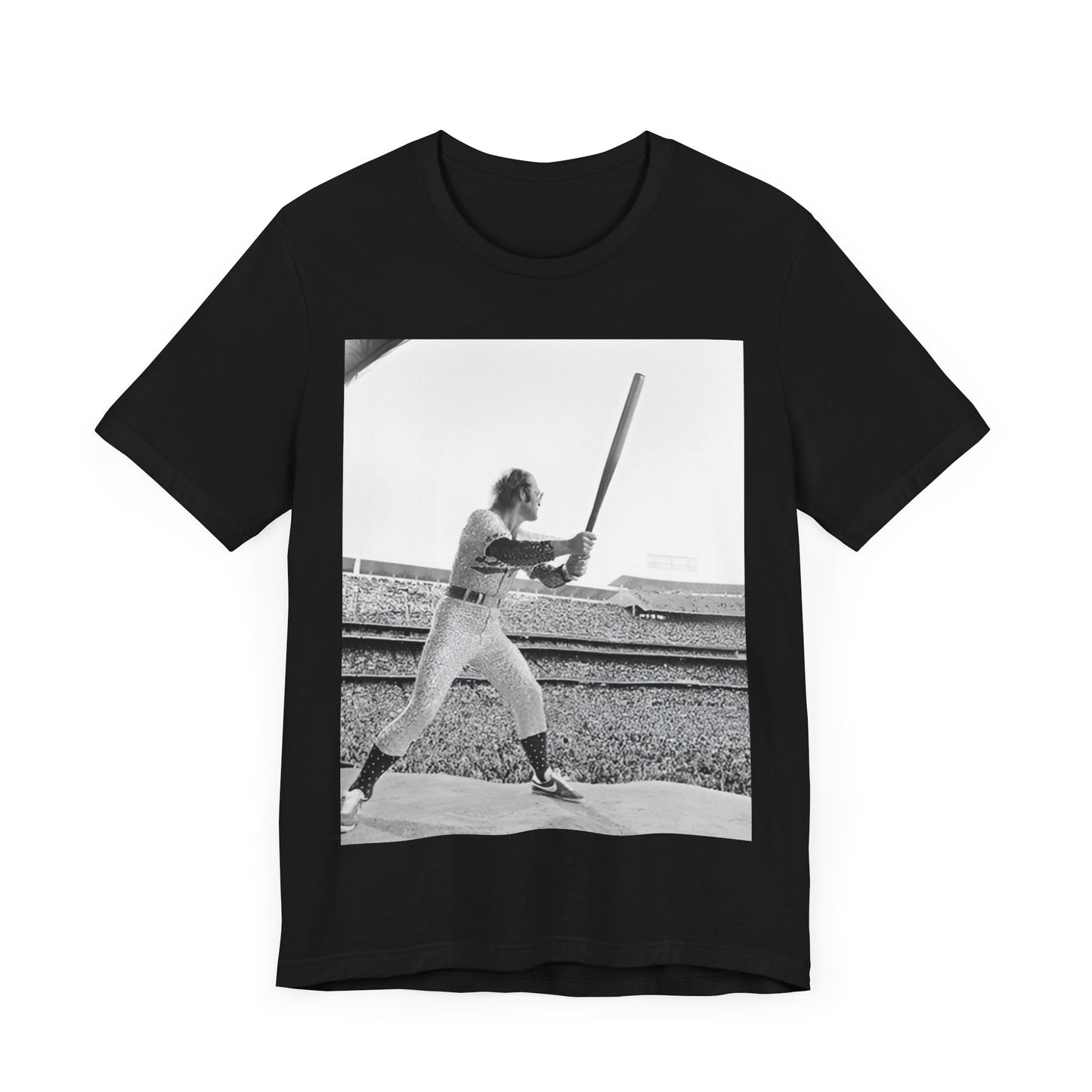 A black graphic t-shirt featuring a black and white graphic or photo related to Elton John's 1975 tour in America.