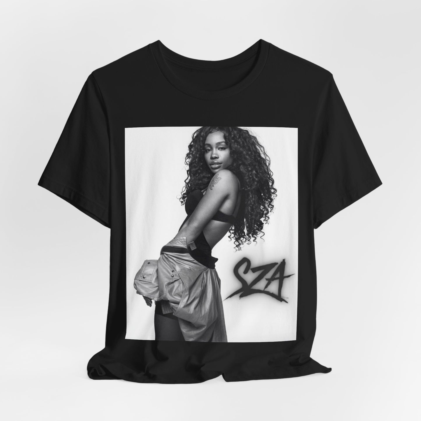 A black graphic t-shirt featuring a black and white portrait photo of SZA.