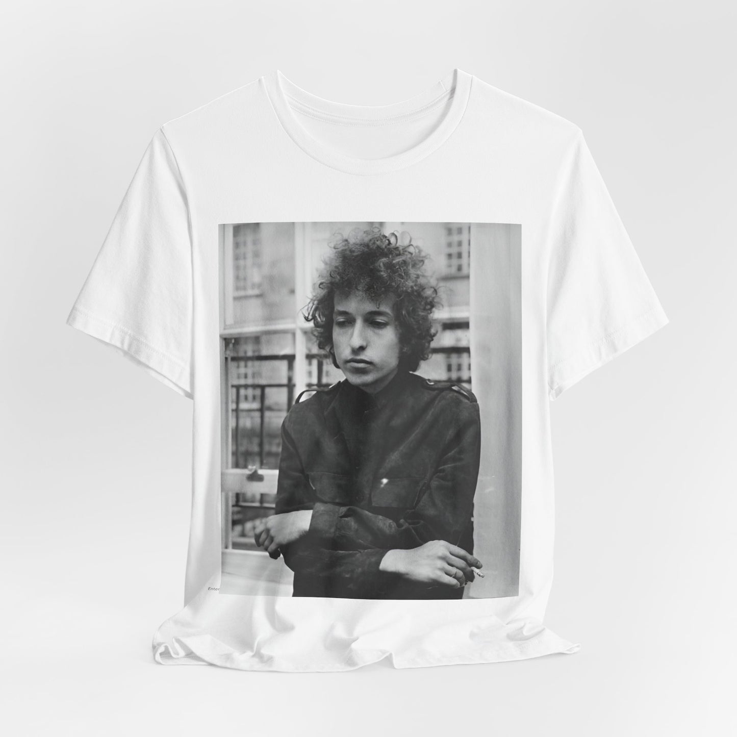A black graphic t-shirt featuring a black and white graphic of Bob Dylan from the folk revival era.