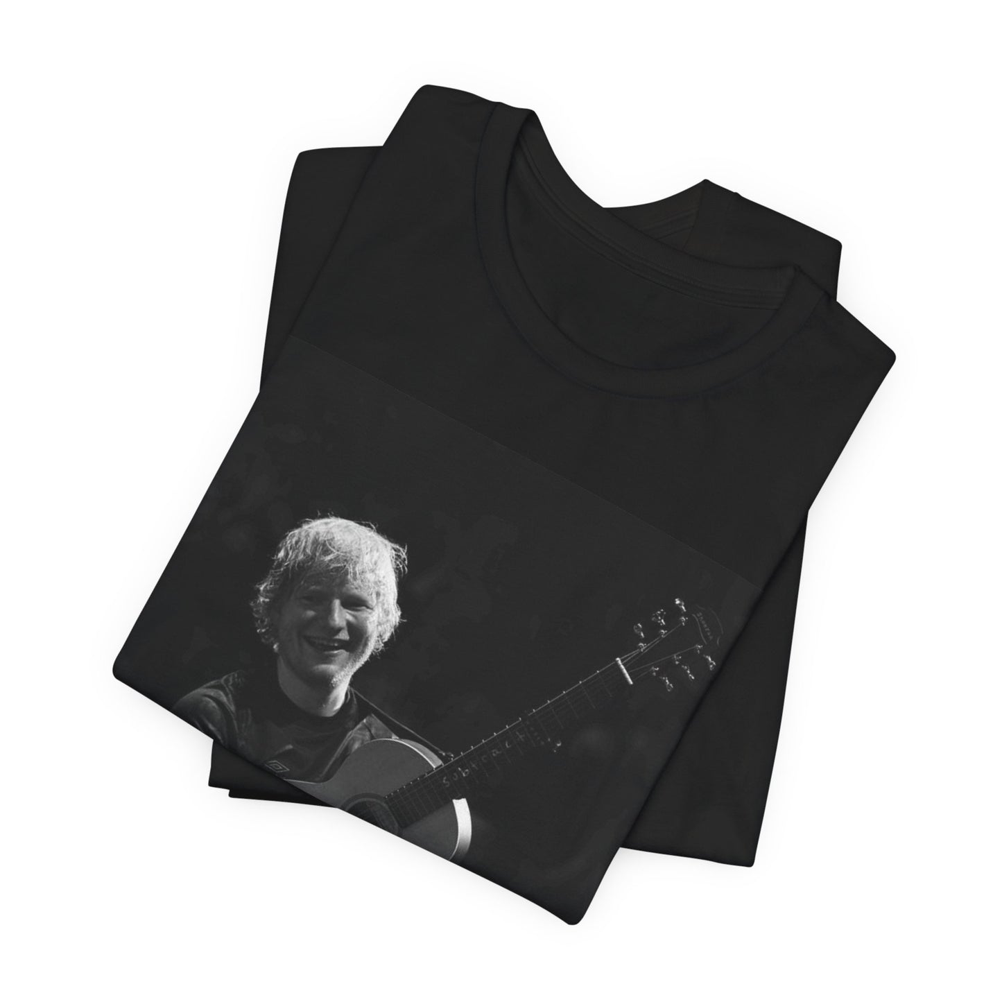 A black graphic t-shirt featuring a photo of Ed Sheeran performing live with his guitar.