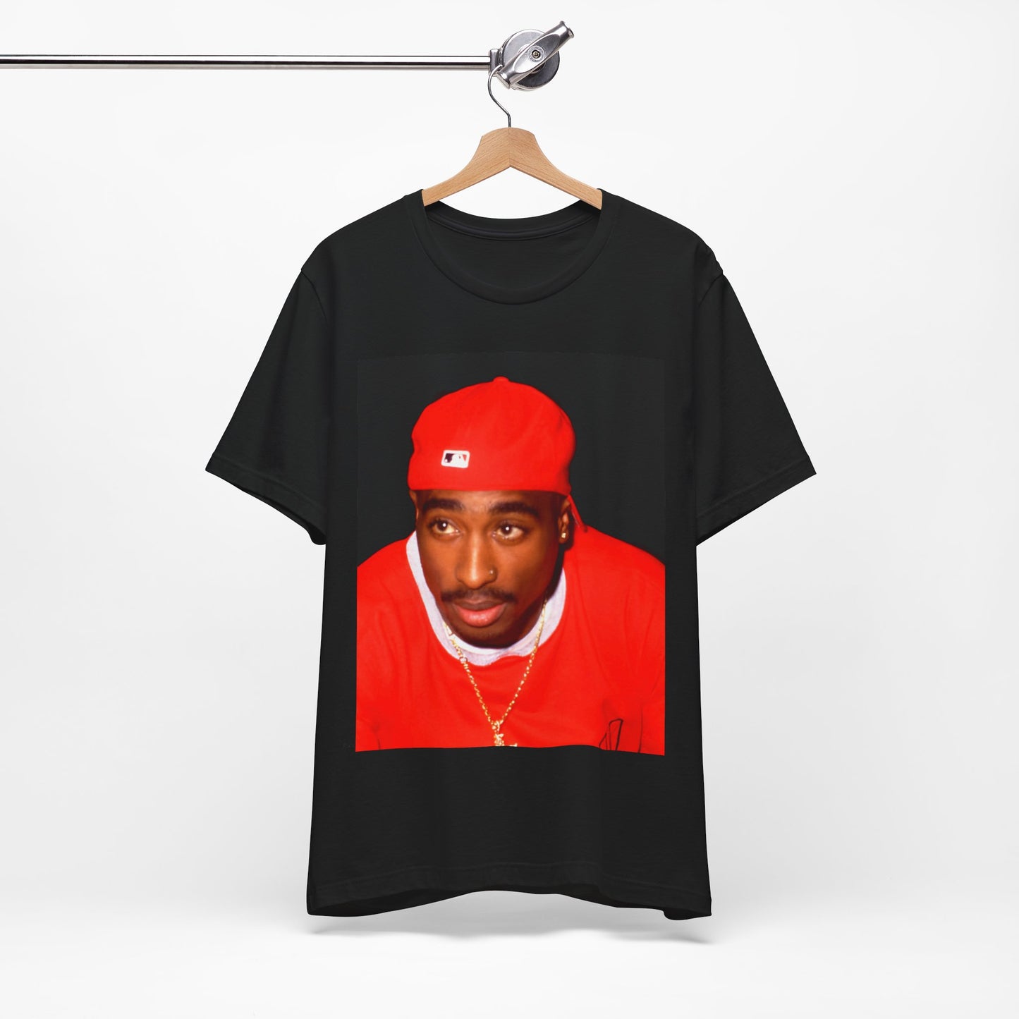 A black graphic t-shirt featuring a fierce graphic related to Tupac's 'California Love' song or era.