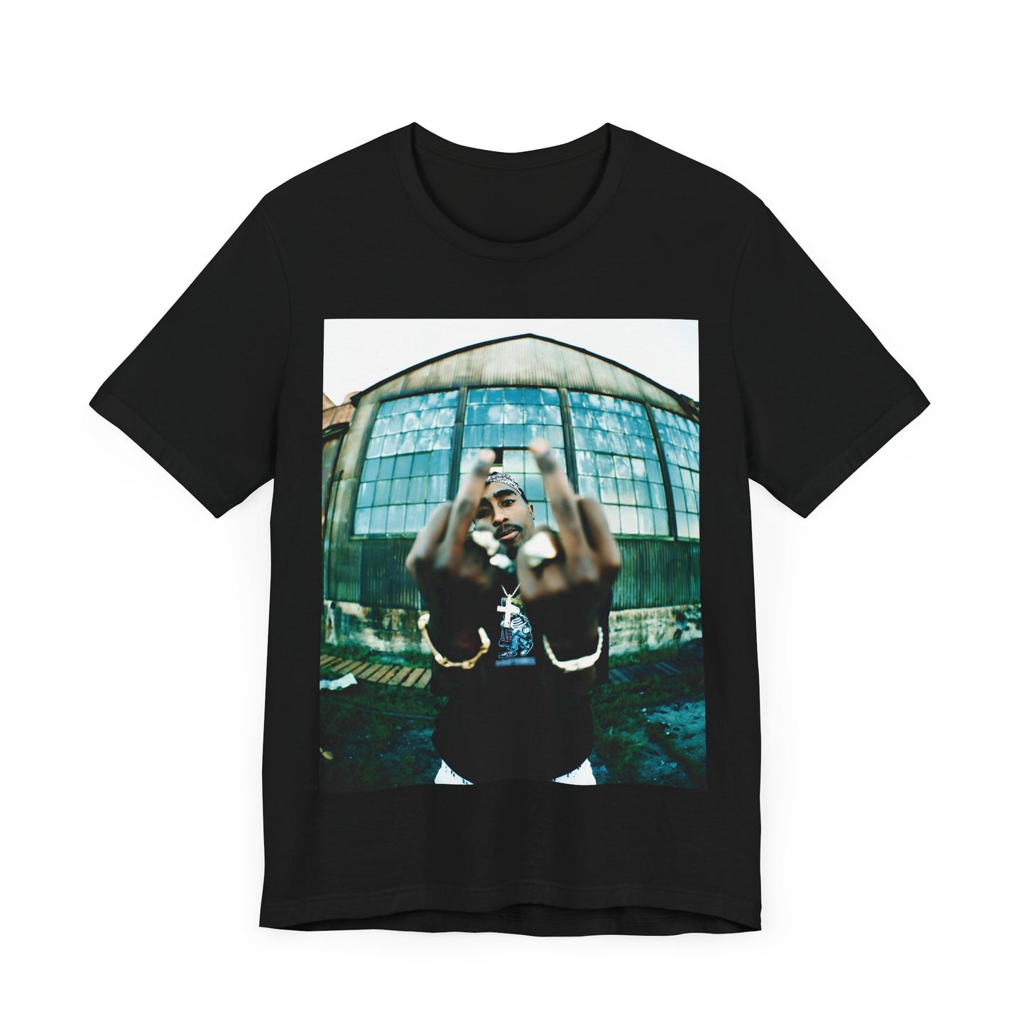 A black graphic t-shirt featuring a graphic of Tupac giving the middle finger.