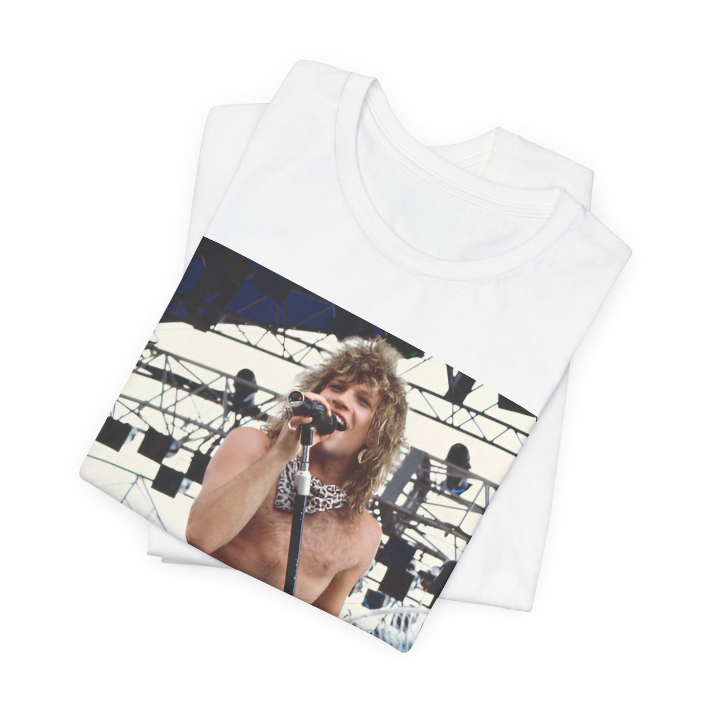 A black graphic t-shirt featuring a dynamic graphic or photo of Bon Jovi performing live on stage with a fierce intensity.