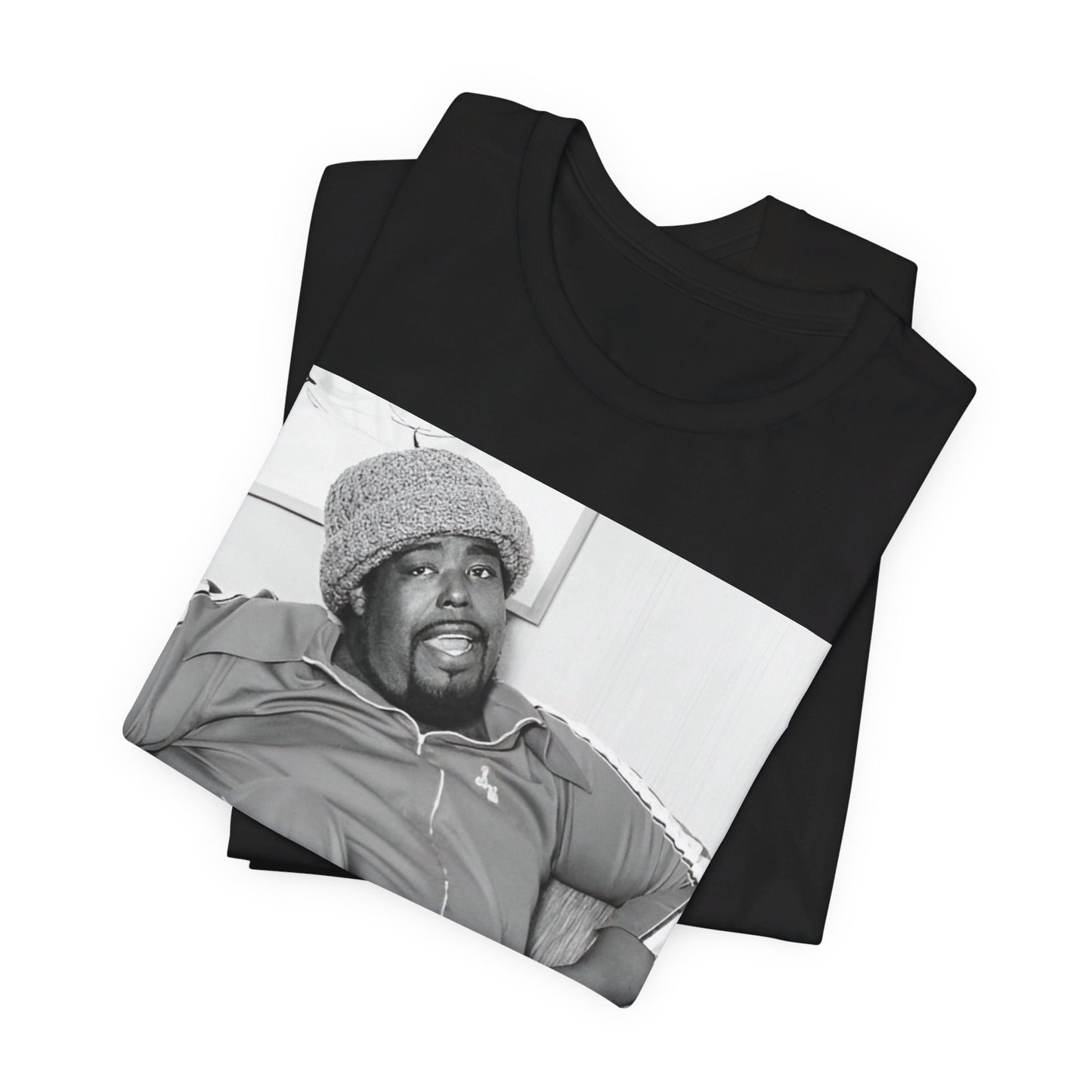 A black graphic t-shirt featuring a 70s-style portrait photo of Barry White in a lounge setting.