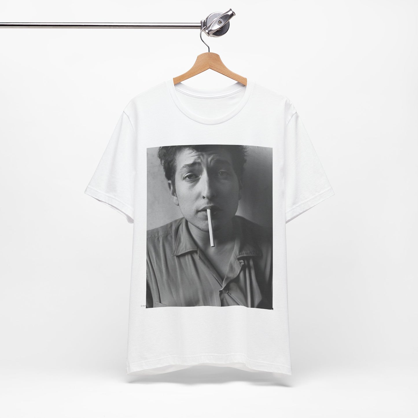 A black graphic t-shirt featuring a graphic of Bob Dylan from the 60s, depicted as a renegade folk icon.