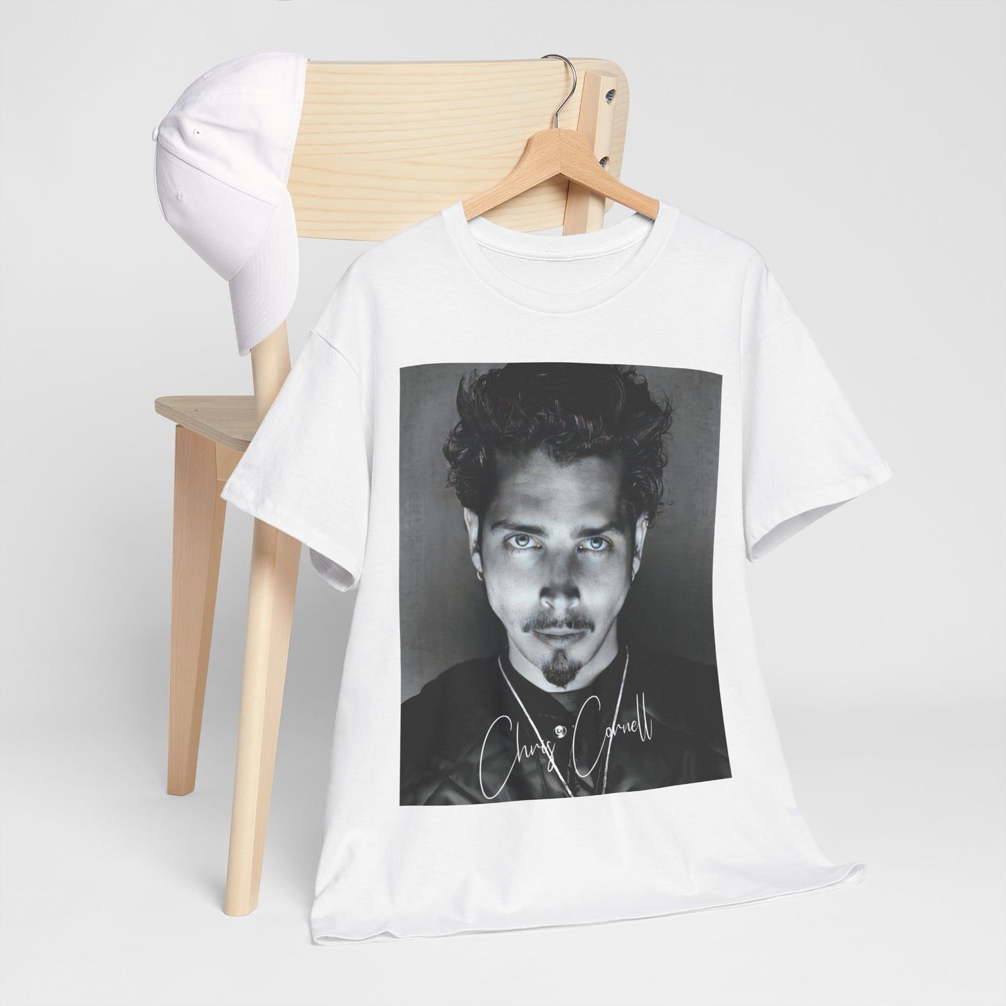 A black graphic t-shirt featuring a retro graphic inspired by Soundgarden's 'Black Hole Sun' and Chris Cornell.
