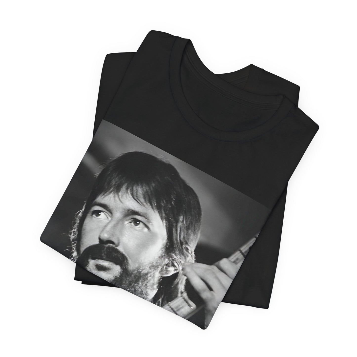 A black graphic t-shirt featuring a graphic of Eric Clapton as an authentic guitar god.
