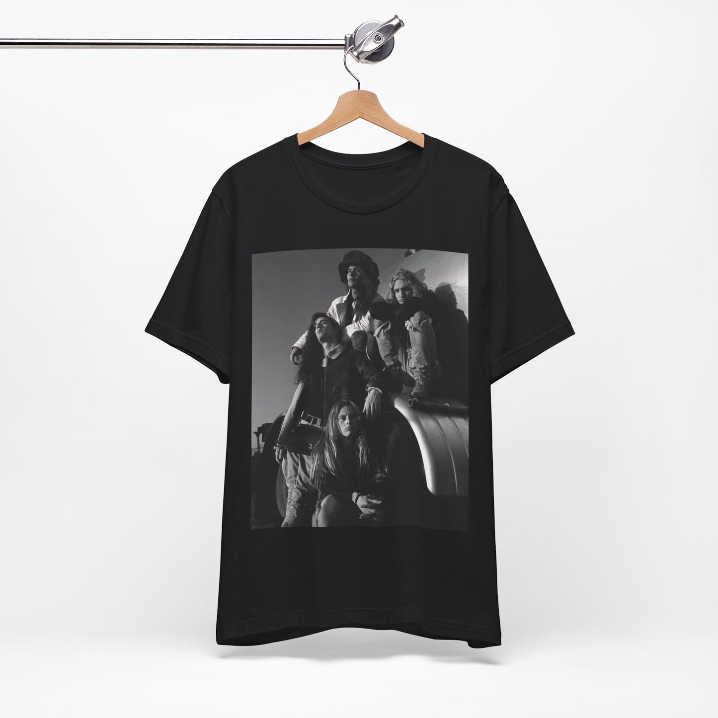 A black graphic t-shirt featuring a 90s black and white photographic portrait of the band Alice In Chains, capturing their iconic grunge look.