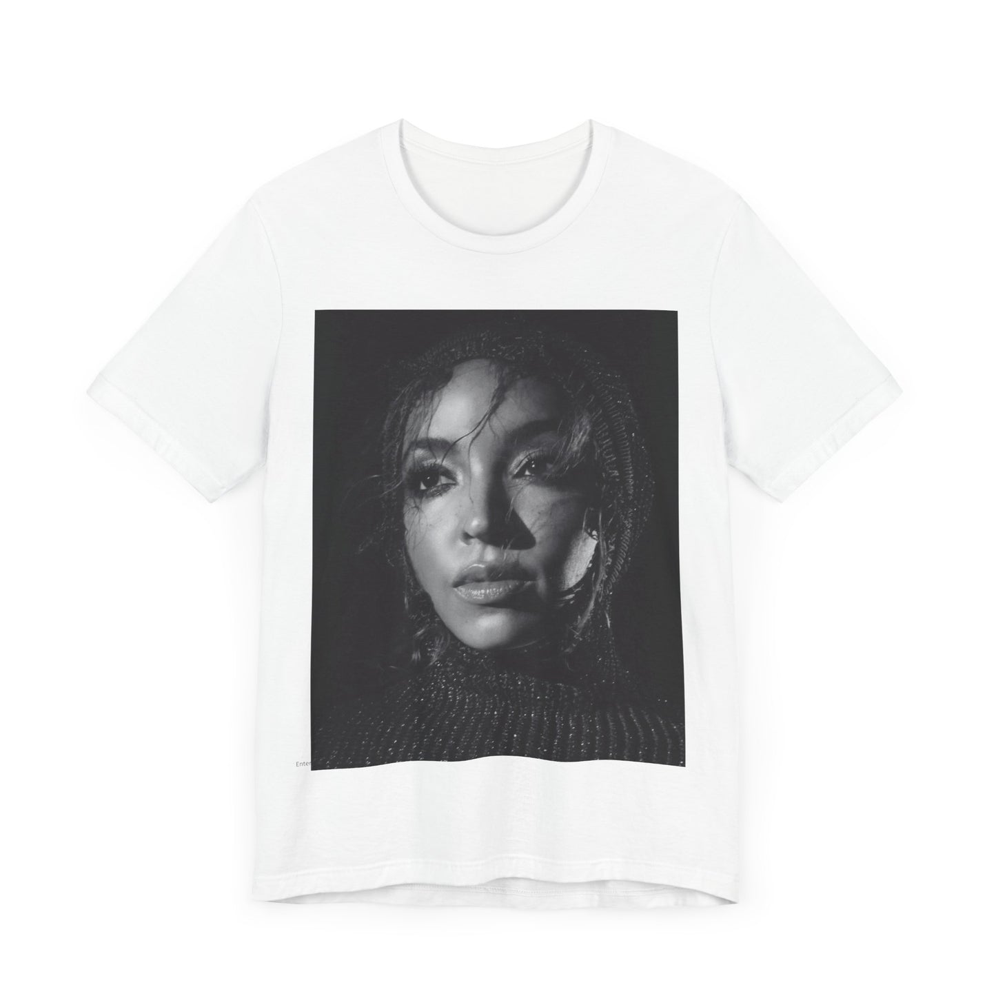 A black graphic t-shirt featuring a black and white portrait photo of Tinashe.