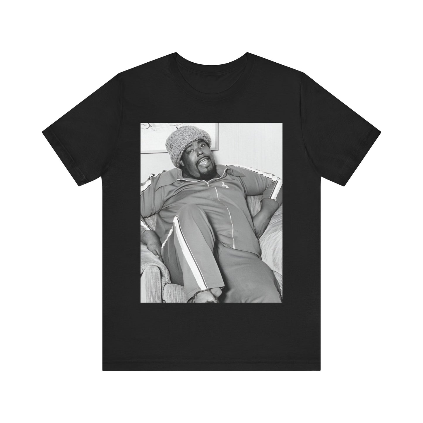A black graphic t-shirt featuring a 70s-style portrait photo of Barry White in a lounge setting.