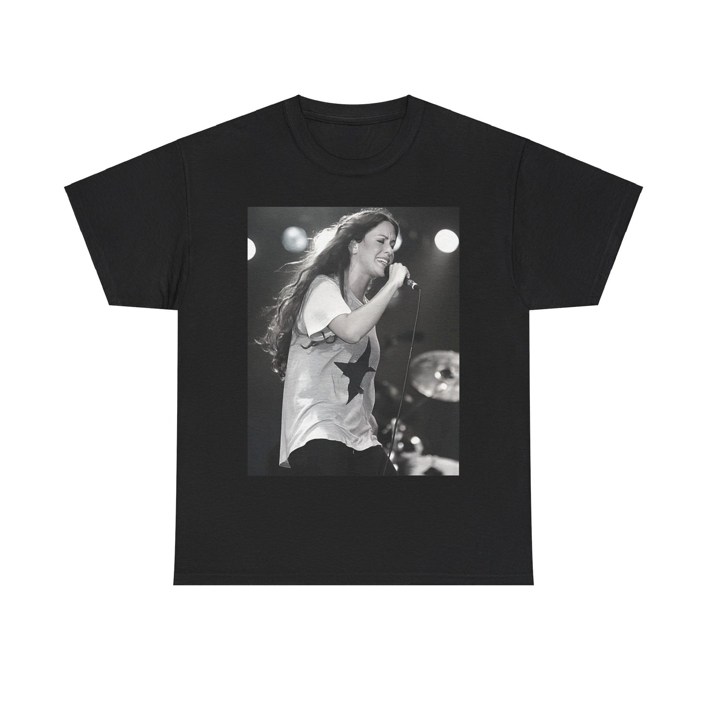 A black graphic t-shirt featuring a photo of Alanis Morissette performing live on stage in the 1990s, with a dynamic expression.