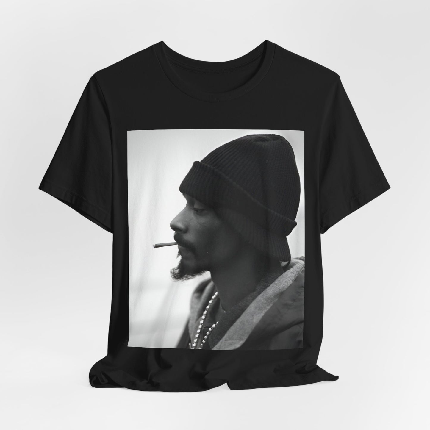 A black graphic t-shirt featuring a graphic of Snoop Dogg designed for everyday West Coast style.