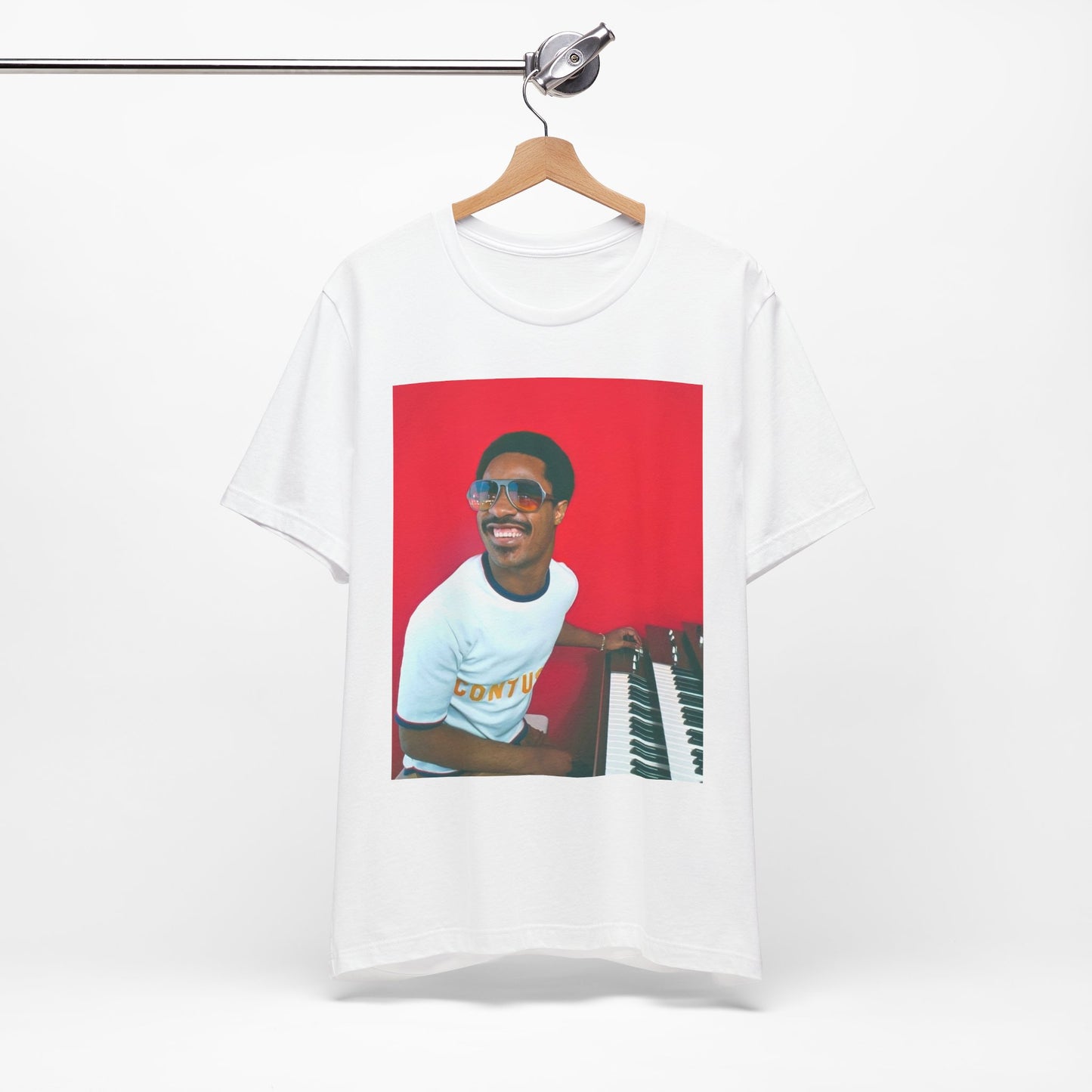 A black graphic t-shirt featuring a graphic of Stevie Wonder with a piano.