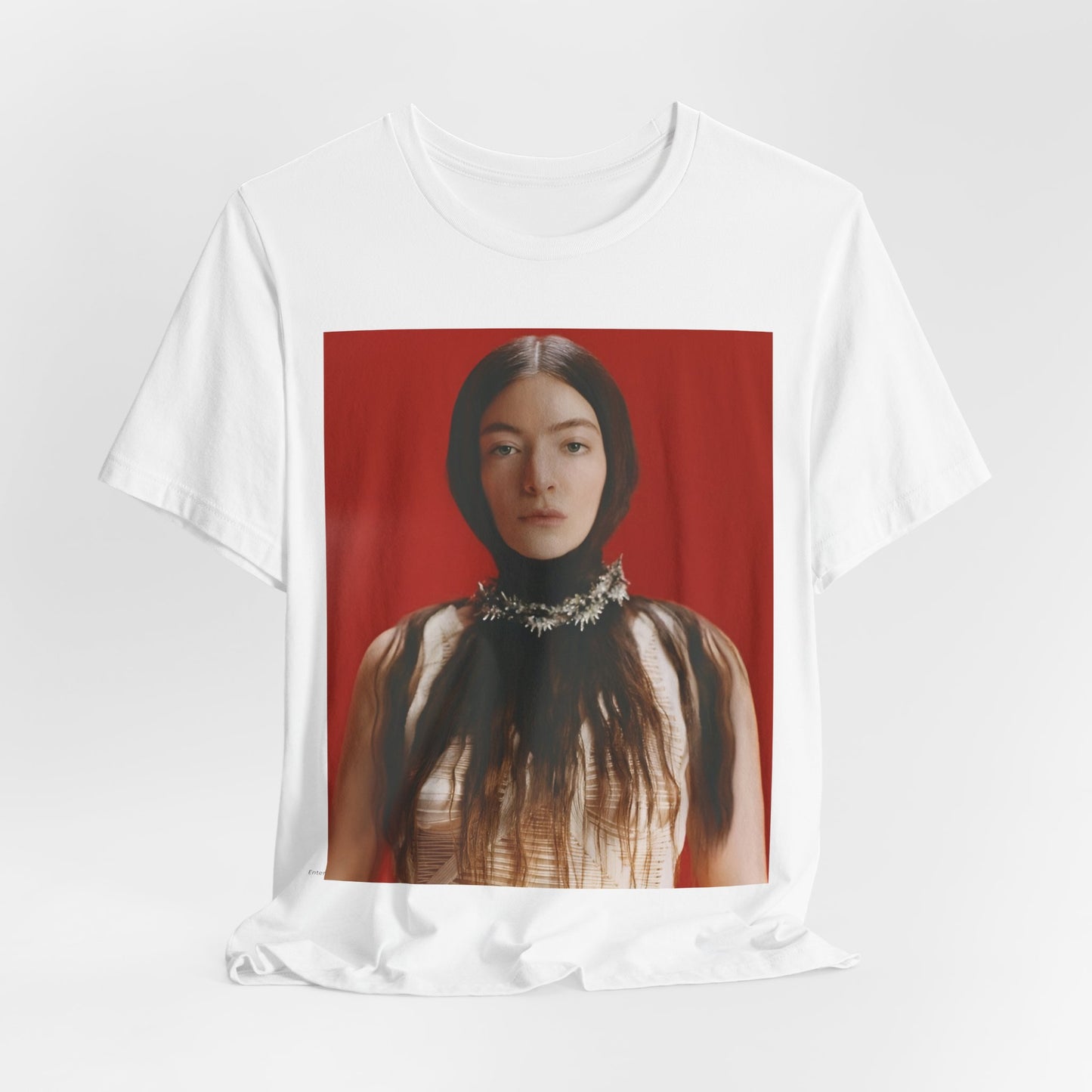 A black graphic t-shirt featuring a vintage indie pop icon graphic of Lorde.