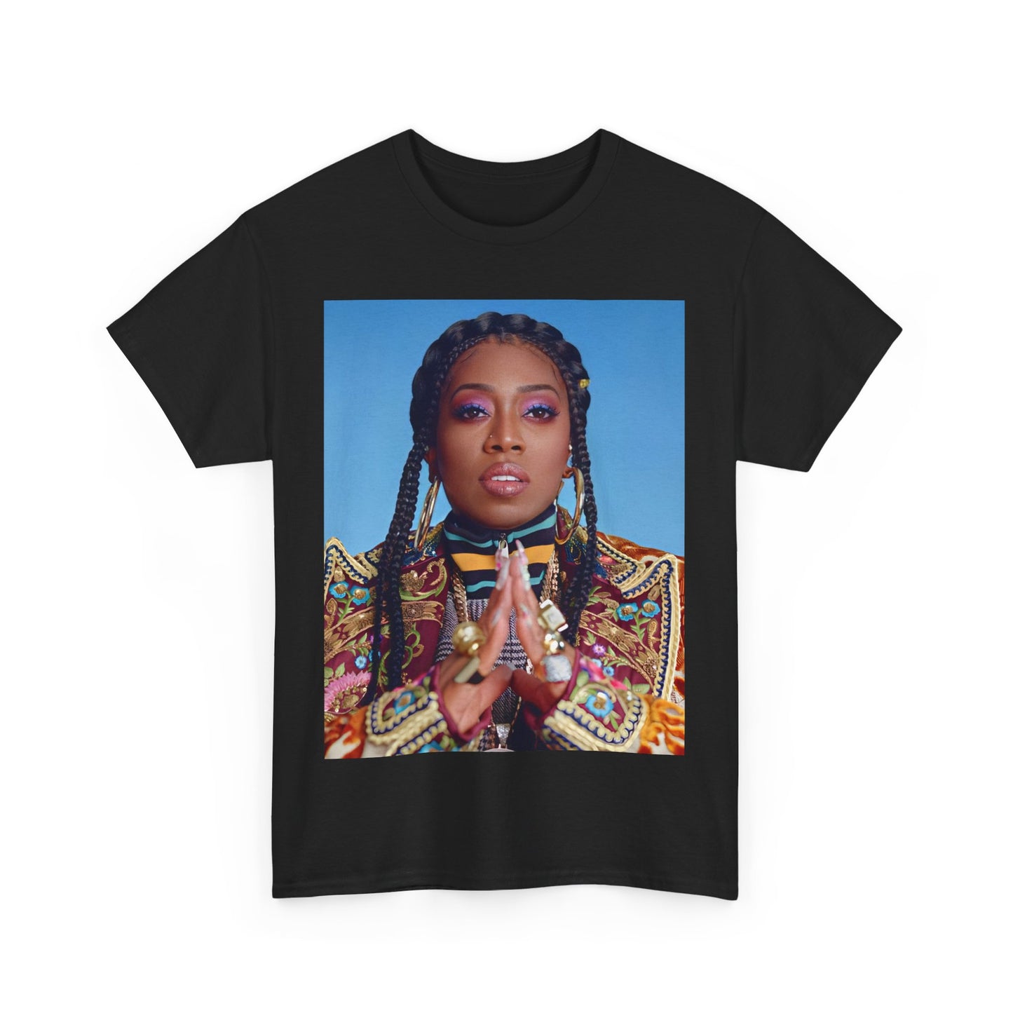 A black graphic t-shirt featuring a graphic of Missy Elliott with a cool, futuristic rap fashion aesthetic.