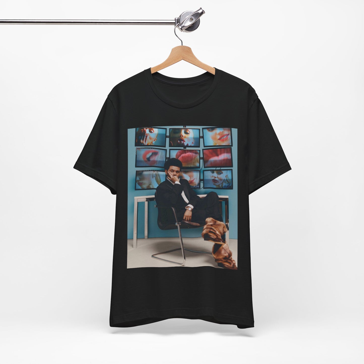 A black graphic t-shirt featuring an aesthetic graphic of The Weeknd.