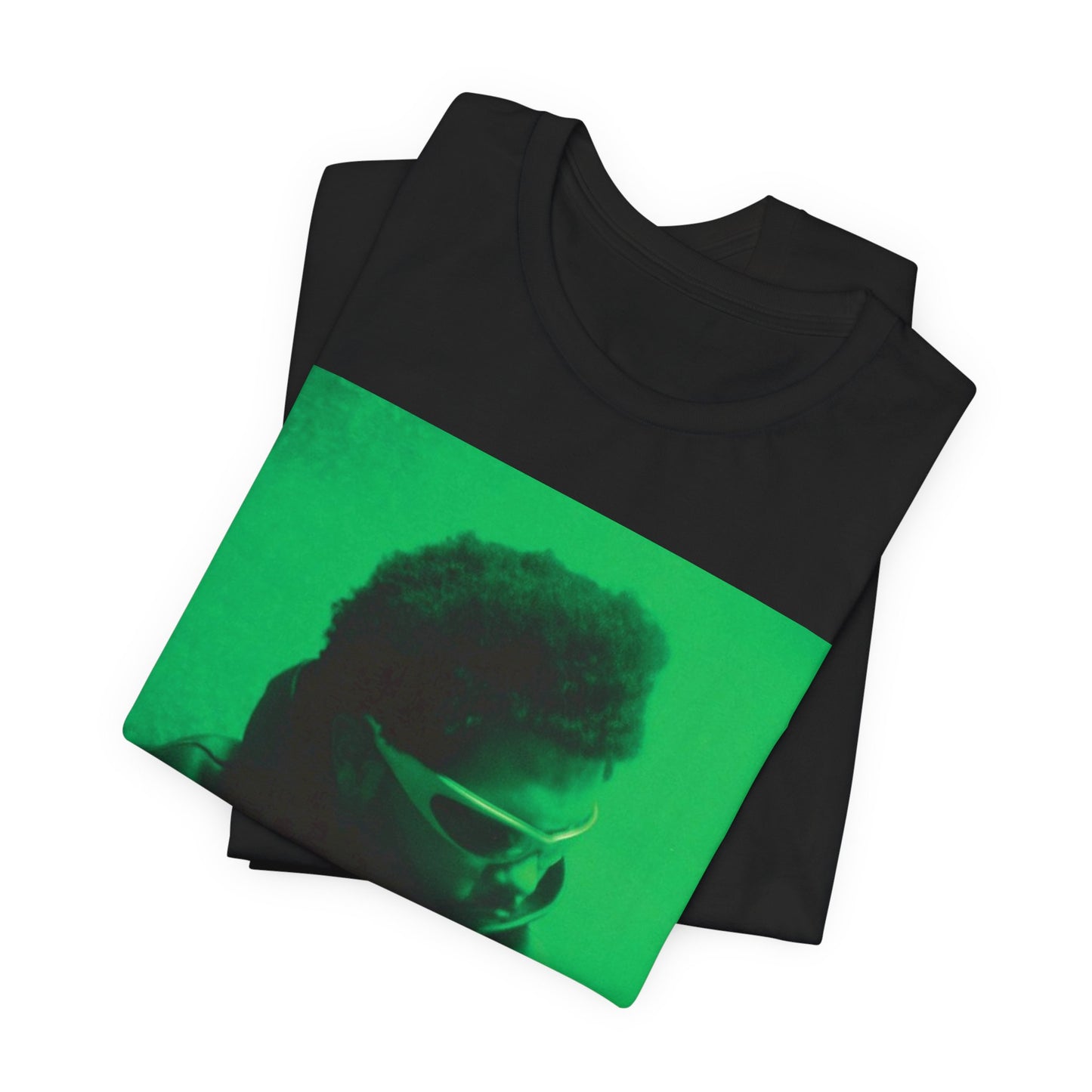 A black graphic t-shirt featuring a vintage graphic related to The Weeknd's 'Kiss Land' era.