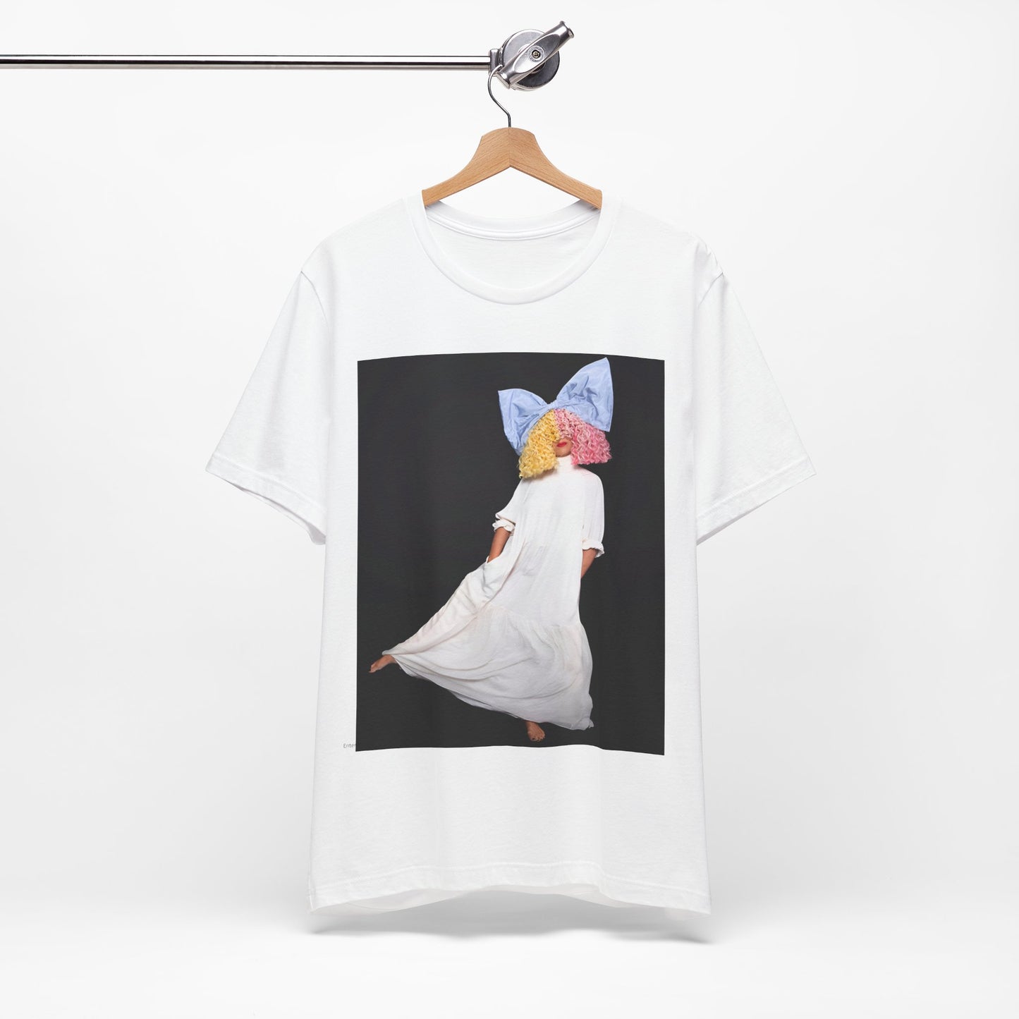 A black graphic t-shirt featuring a vintage pop icon graphic of Sia.