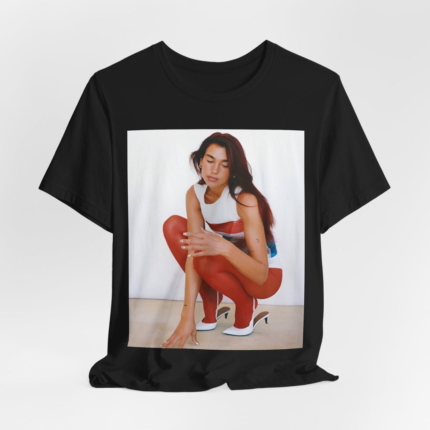 A black graphic t-shirt featuring a graphic of Dua Lipa with a chill pop vibe, designed for comfort.