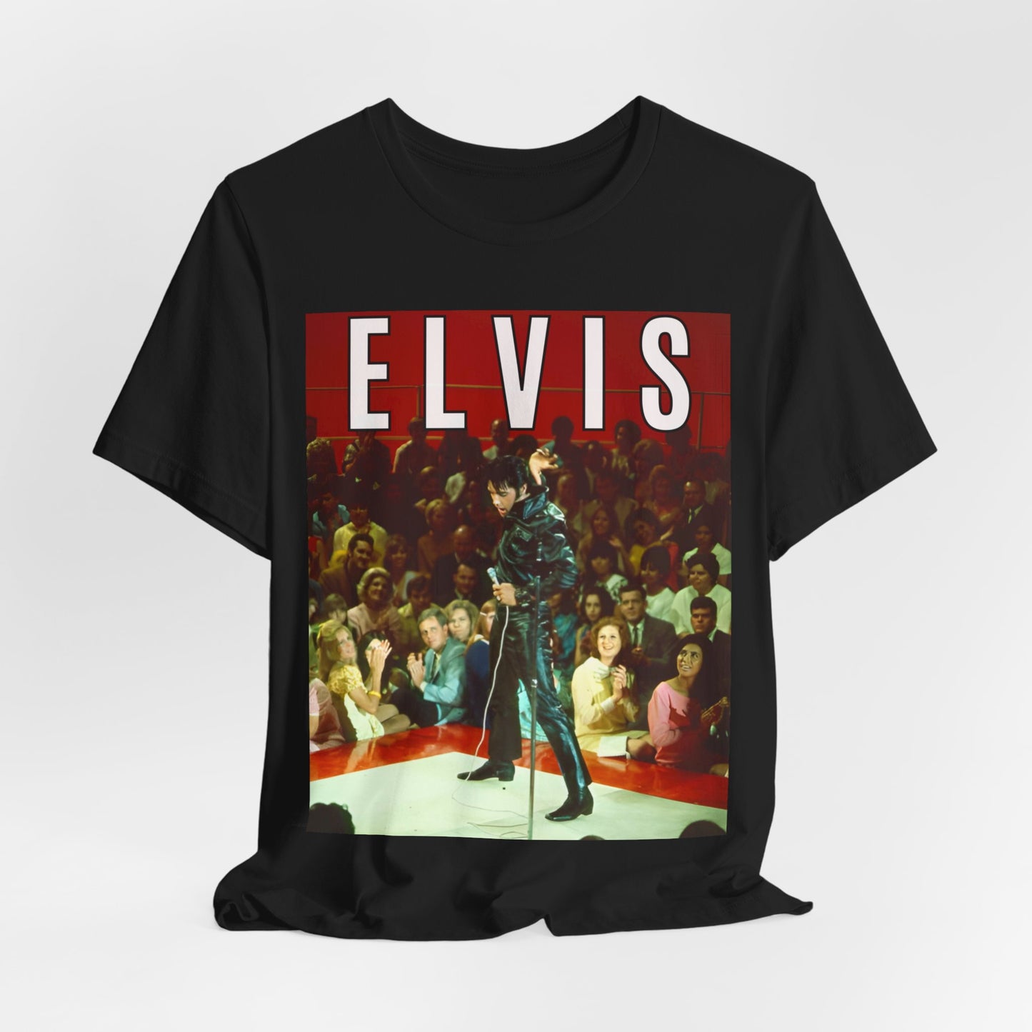 A black graphic t-shirt featuring a retro graphic related to an Elvis Presley special concert.