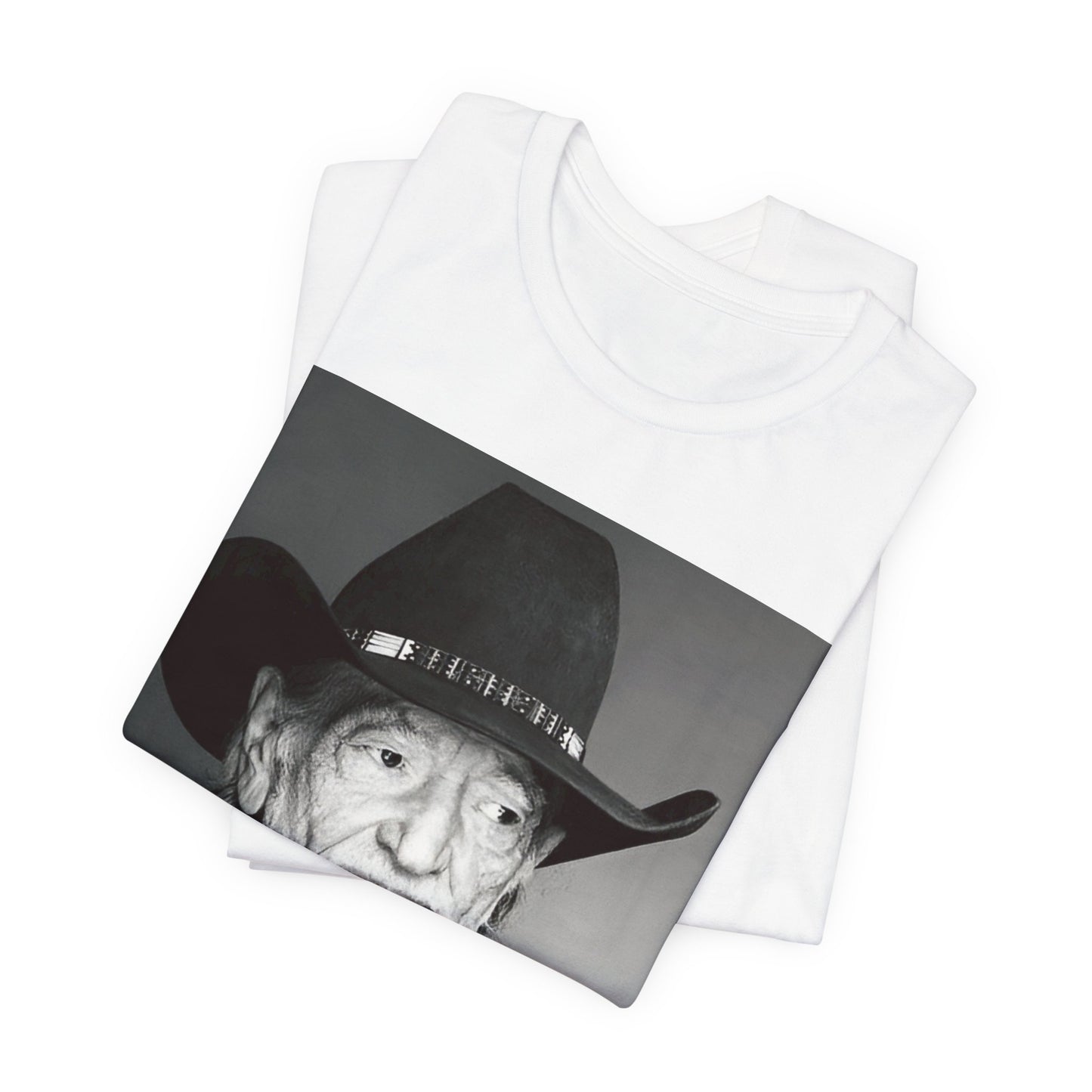 A black graphic t-shirt featuring a graphic of Willie Nelson with his iconic guitar 'Trigger'.