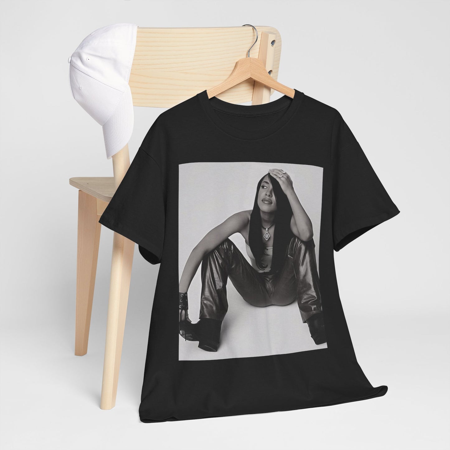 A black graphic t-shirt featuring a graphic of Aaliyah with a feel-good R&B vibe.
