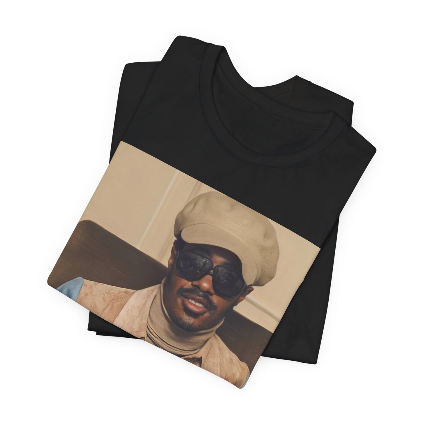 A black graphic t-shirt featuring a retro graphic related to Stevie Wonder's 'Songs in the Key of Life' album era.