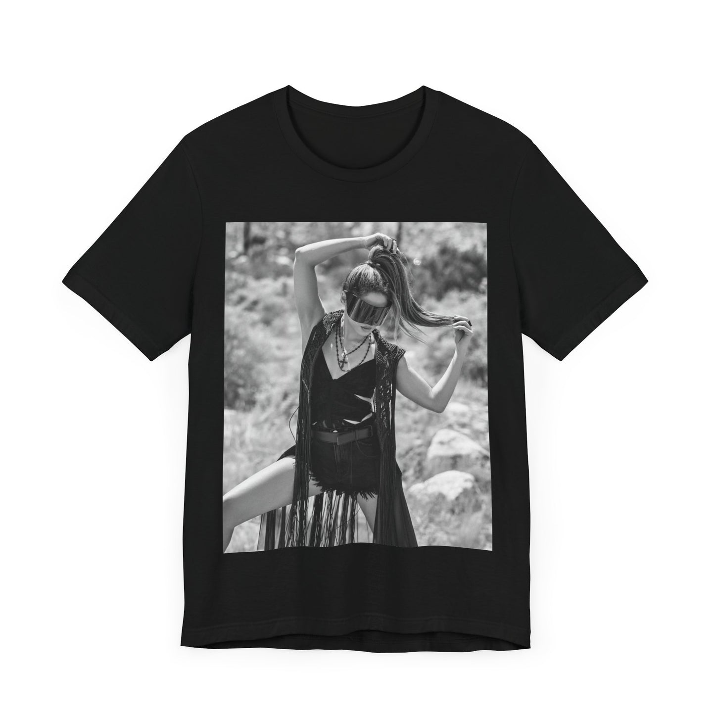 A black graphic t-shirt featuring a black and white, monochrome graphic or photo of Shakira.