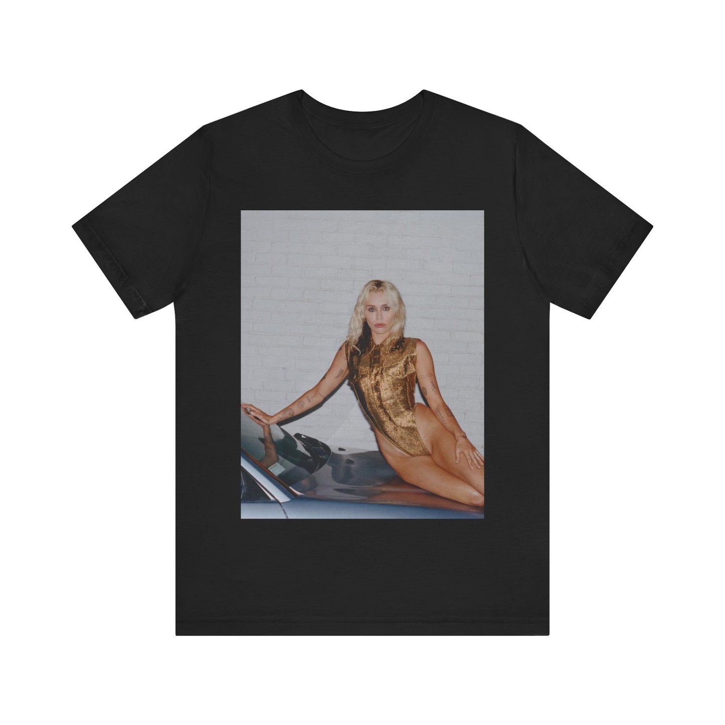 A black graphic t-shirt featuring an iconic fashion graphic of Miley Cyrus.