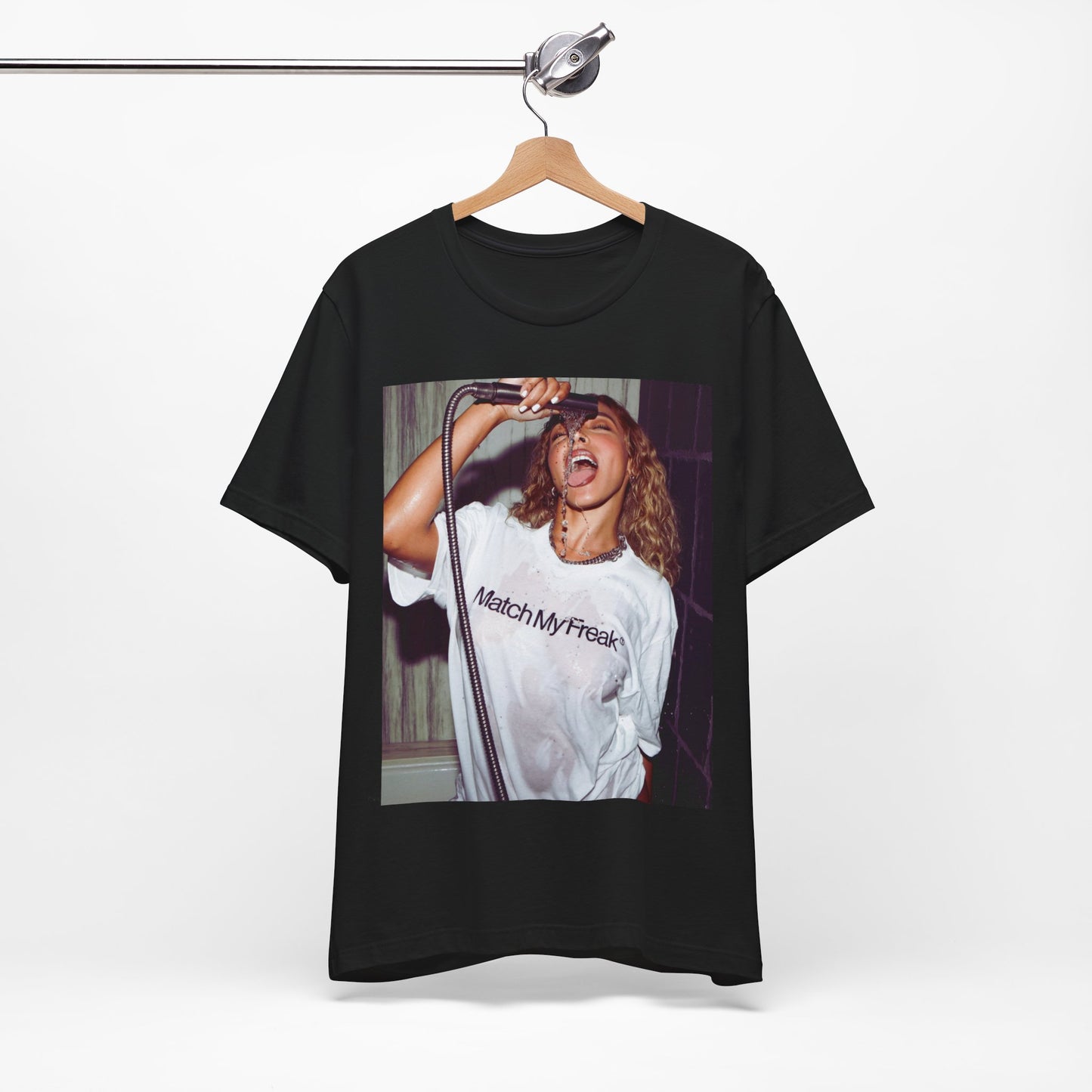 A black graphic t-shirt featuring an aesthetic graphic of Tinashe with a 'Nasty' vibe.