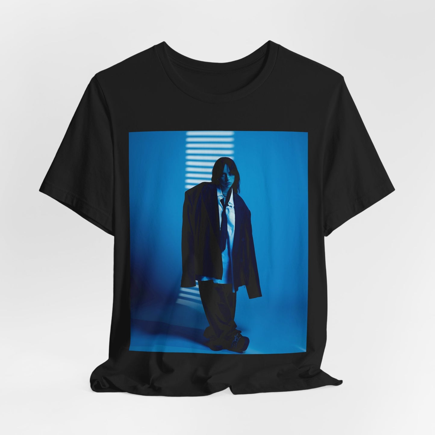 A high-fashion, editorial-style photo of Billie Eilish, embodying a 'breaking the rules' attitude, printed on a graphic t-shirt.