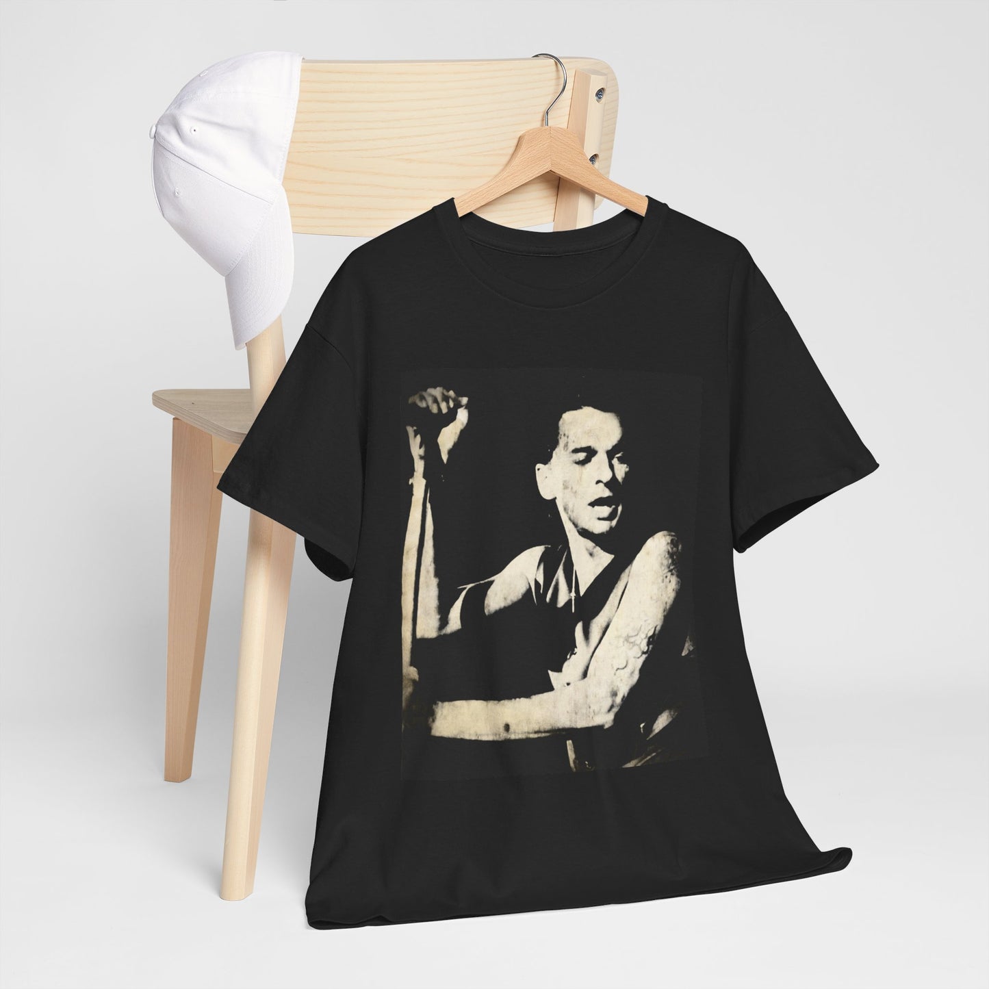 A black graphic t-shirt featuring a black and white graphic or photo of Depeche Mode performing live on stage.