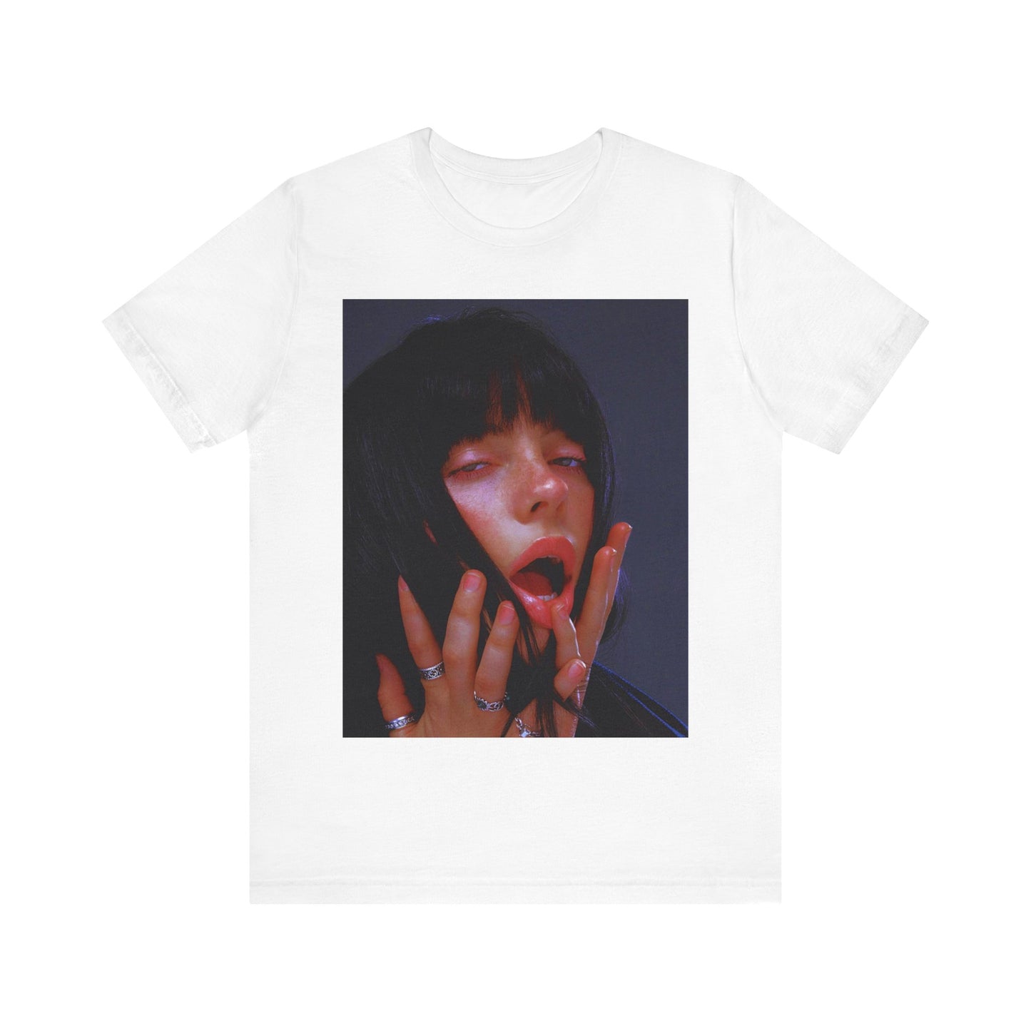 An intense, artistic photo of Billie Eilish with a bloody nose, conveying a sense of raw power, printed on a graphic t-shirt.