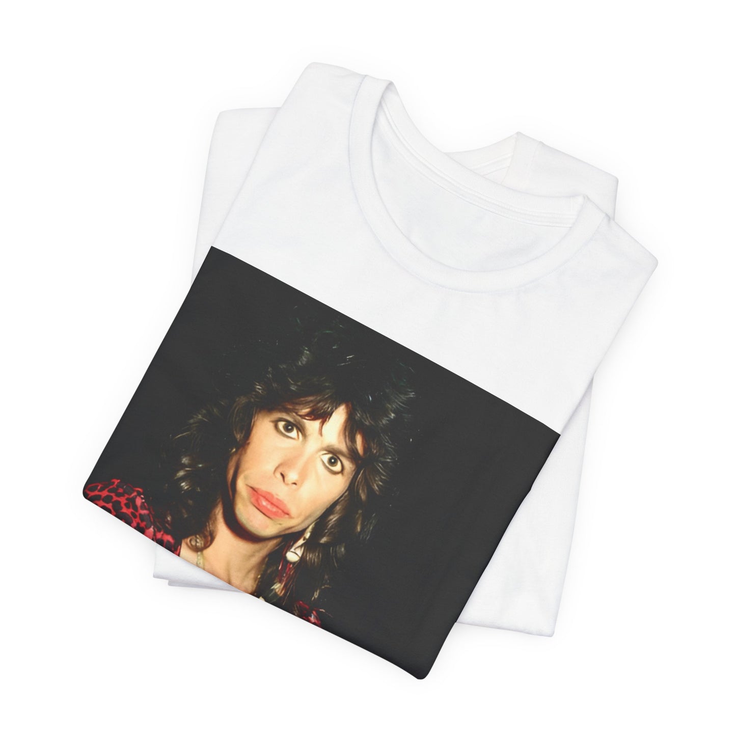 A black graphic t-shirt featuring a vintage 70s-inspired design with Aerosmith branding, incorporating a prominent leopard print pattern.