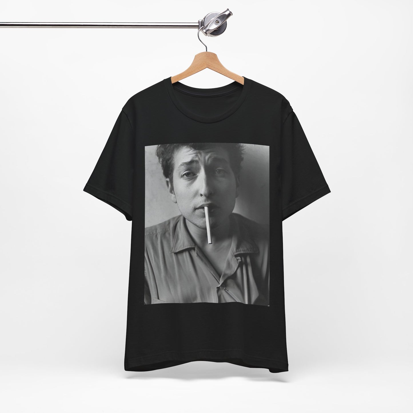 A black graphic t-shirt featuring a graphic of Bob Dylan from the 60s, depicted as a renegade folk icon.