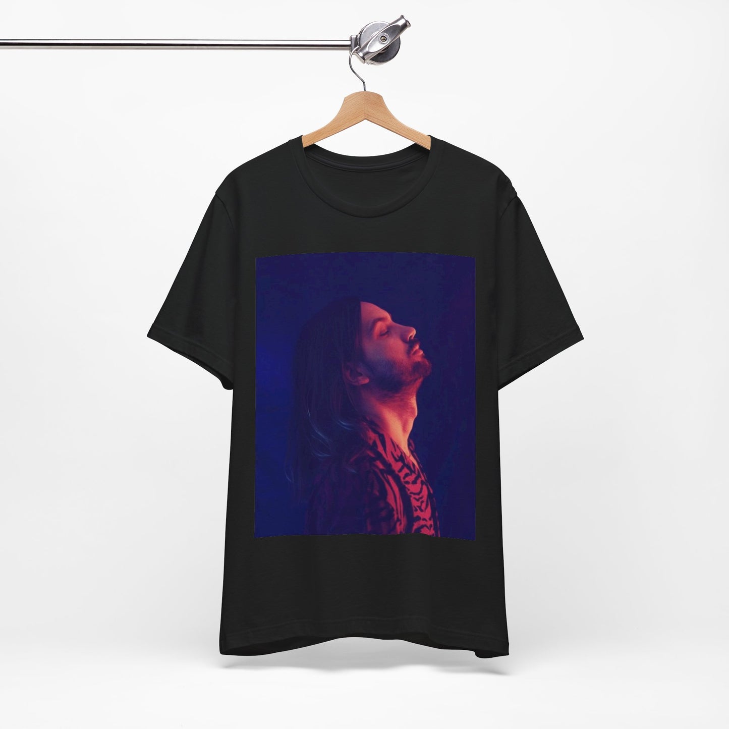 A black graphic t-shirt featuring a retro indie alt-rock graphic of Tame Impala.