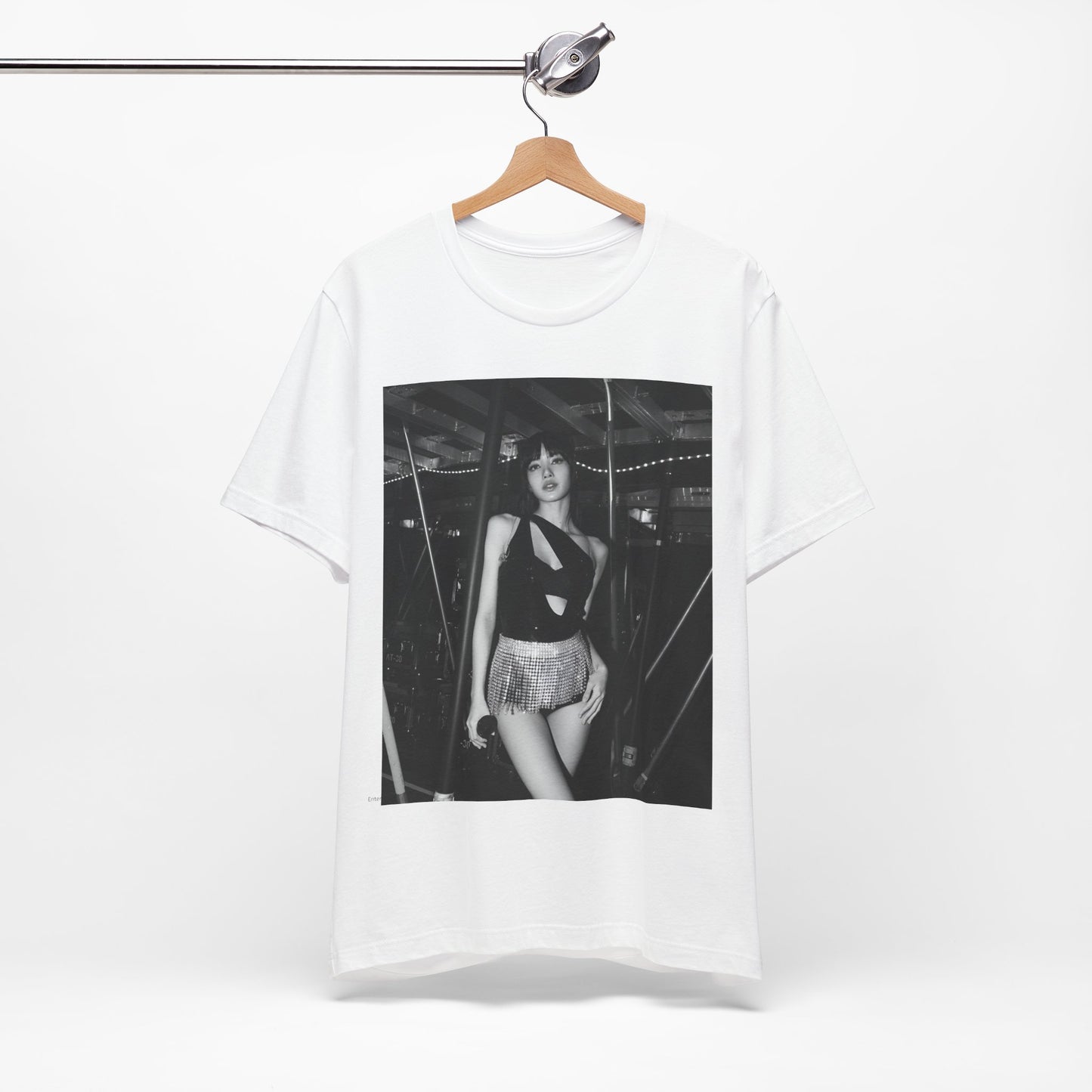 A black graphic t-shirt featuring a black and white graphic or photo of Lisa in a backstage setting.