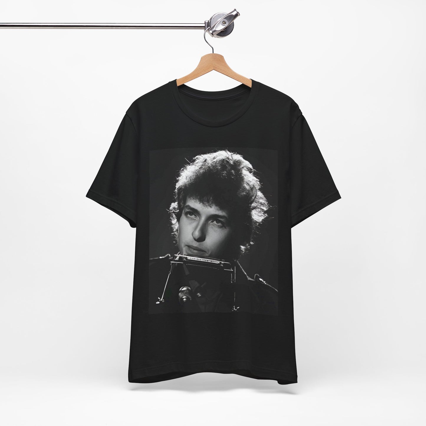 A black graphic t-shirt featuring a graphic of Bob Dylan from the 60s playing his harmonica.