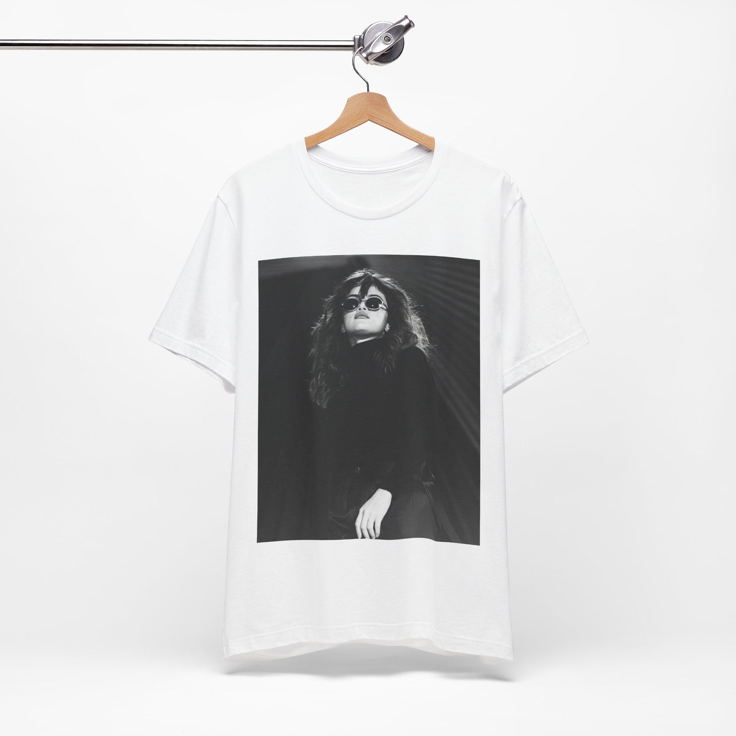 A black graphic t-shirt featuring a black and white, monochrome graphic or photo of Selena Gomez.