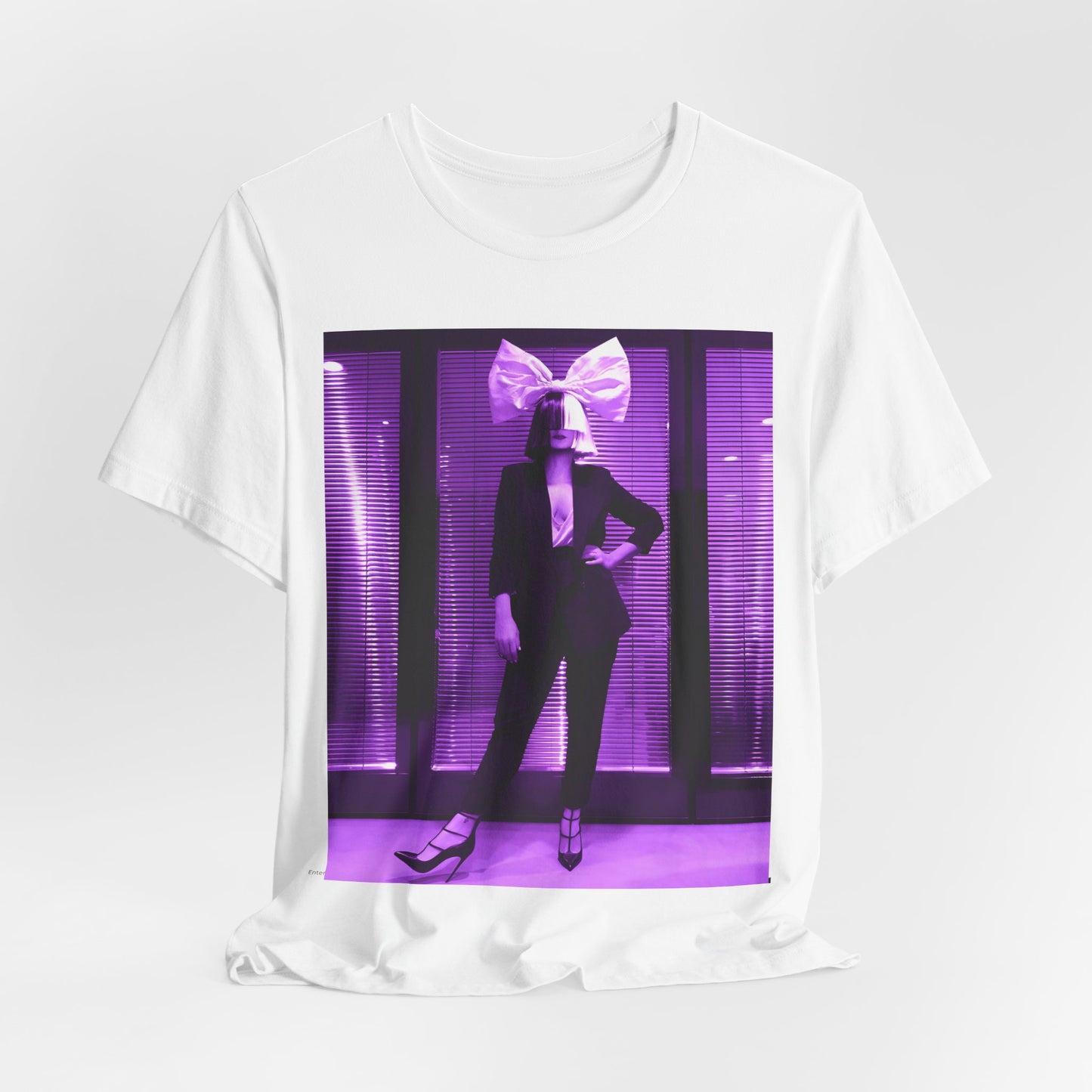 A black graphic t-shirt featuring a vintage pop diva graphic of Sia.