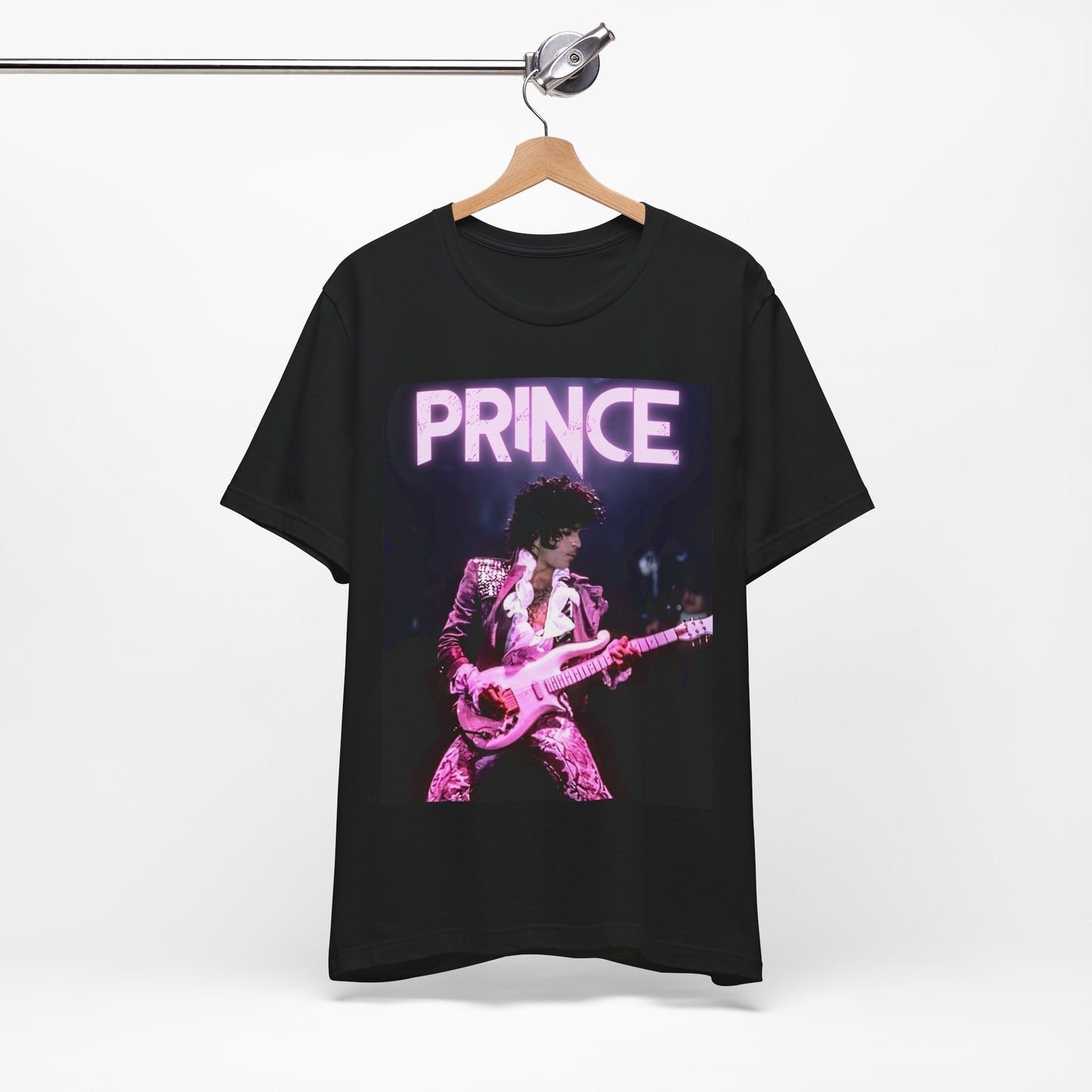 A black graphic t-shirt featuring an 80s pop genius graphic of Prince.