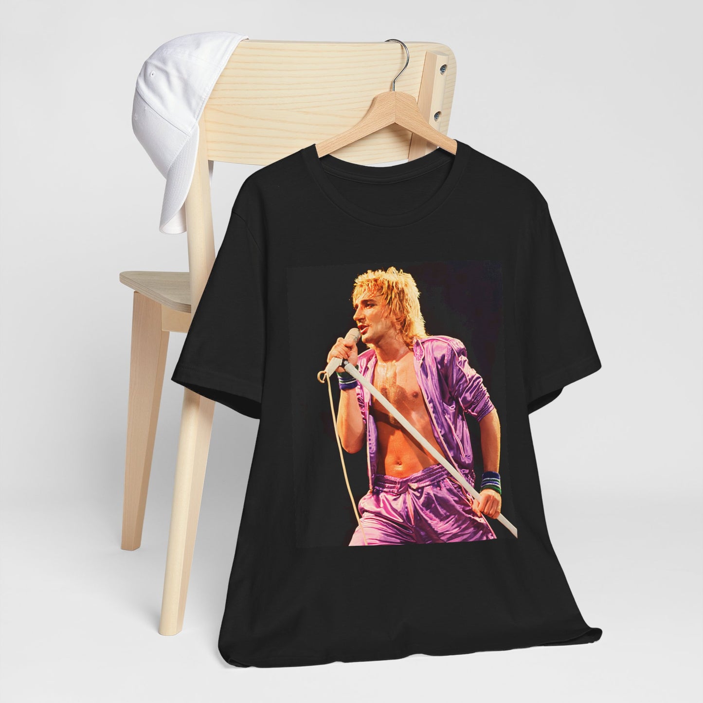 A black graphic t-shirt featuring a retro graphic related to Rod Stewart's 'Do Ya Think I'm Sexy' song or era.
