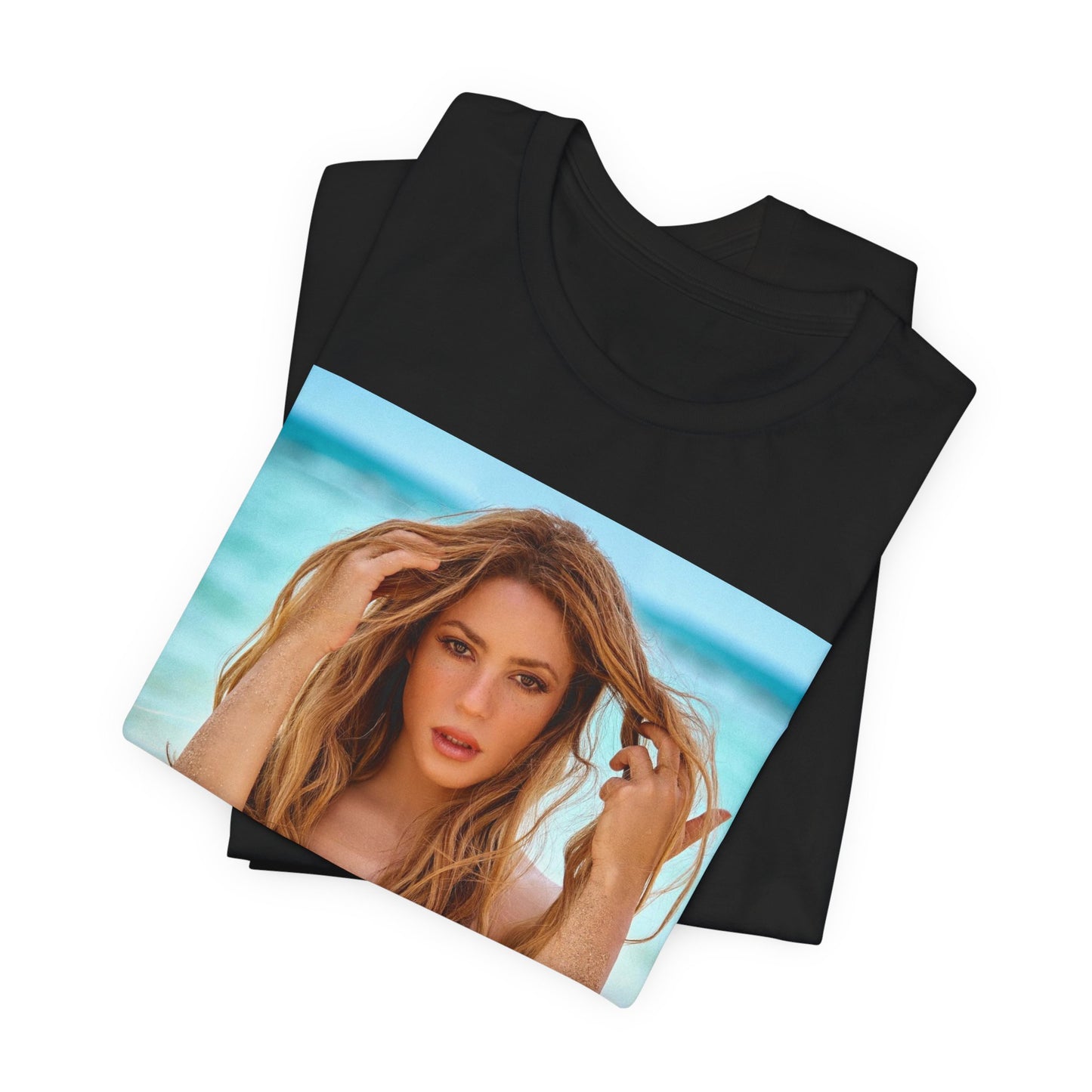 A black graphic t-shirt featuring a graphic of Shakira with a feel-good Latin pop vibe.