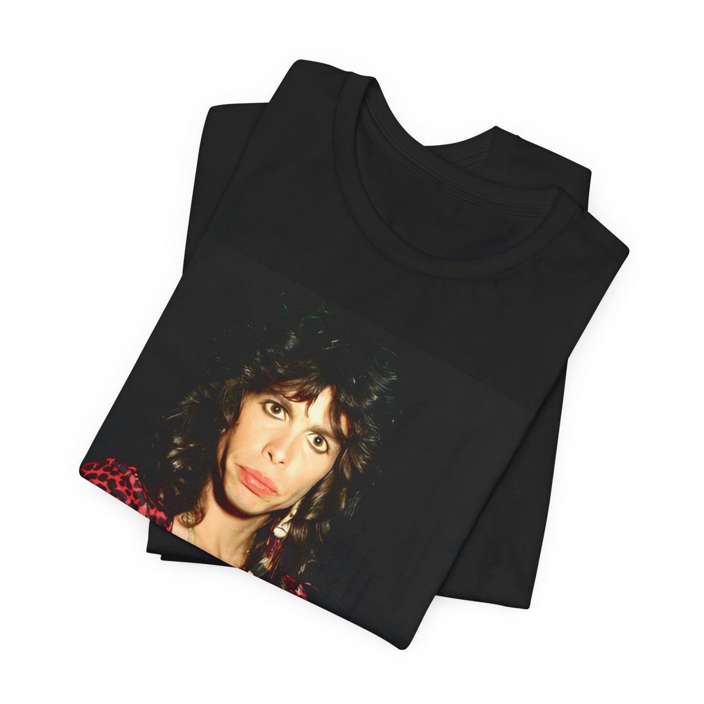 A black graphic t-shirt featuring a vintage 70s-inspired design with Aerosmith branding, incorporating a prominent leopard print pattern.