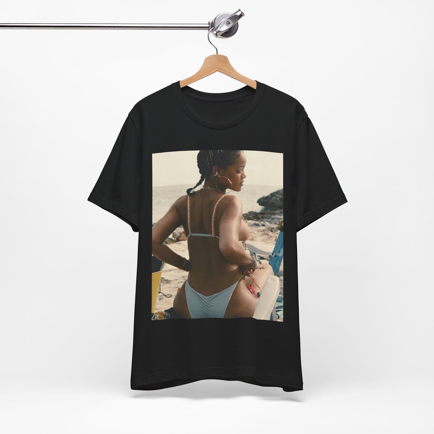 A black graphic t-shirt featuring a graphic of Rihanna as a bikini babe in paradise.