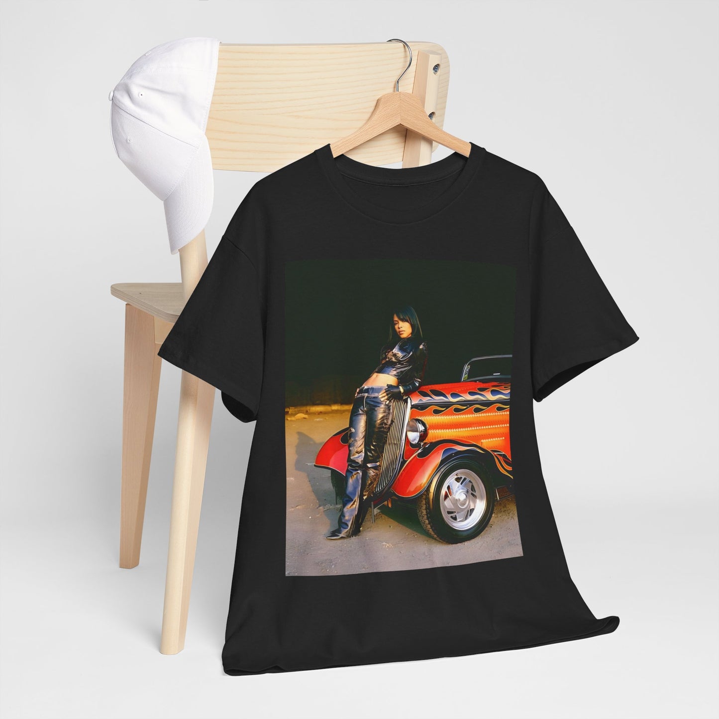 A black graphic t-shirt featuring a graphic of Aaliyah as an unapologetic R&B queen.